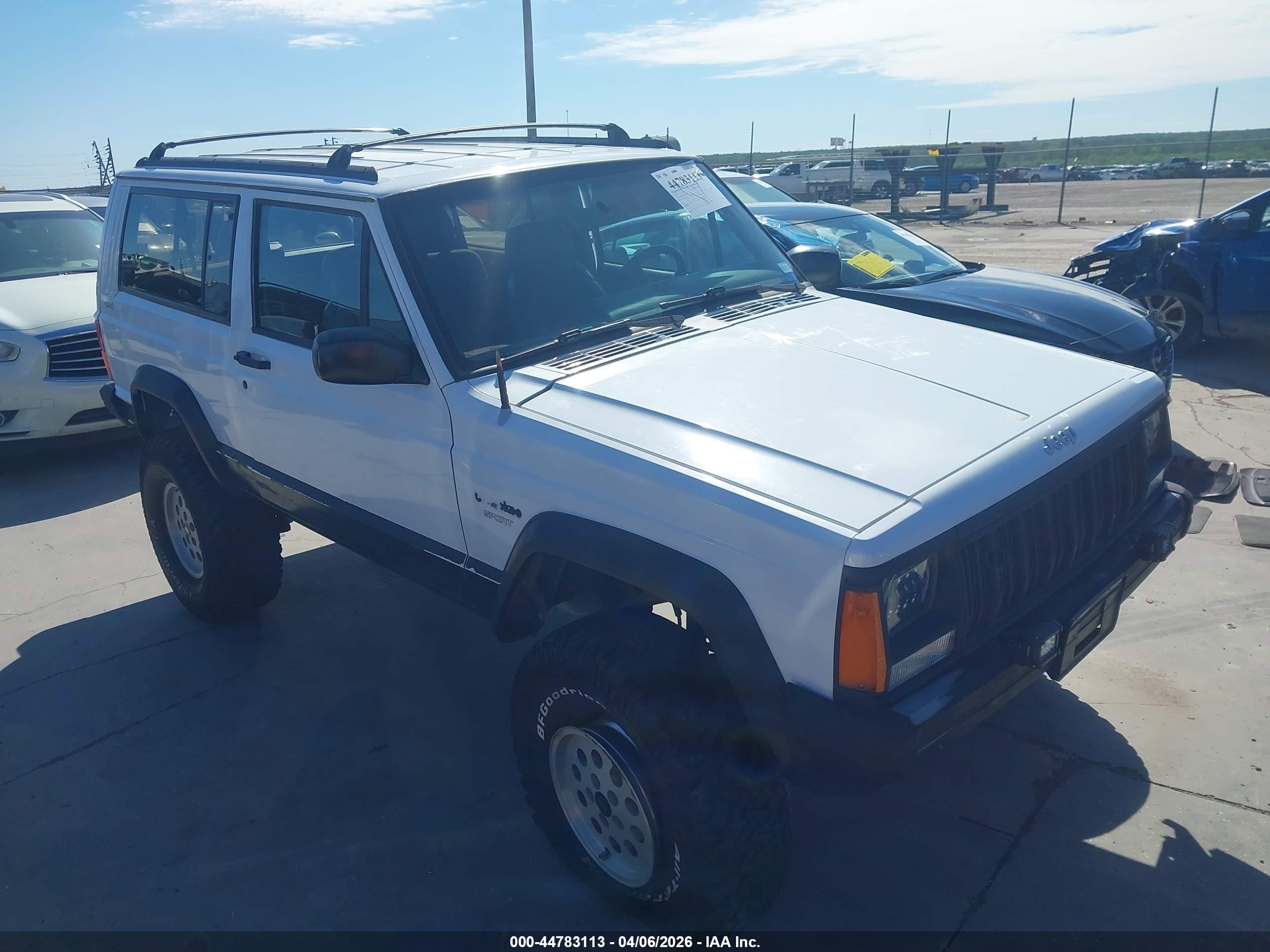 1994 Jeep Cherokee Sport, VIN 1J4FJ67S8RL128140 — Side