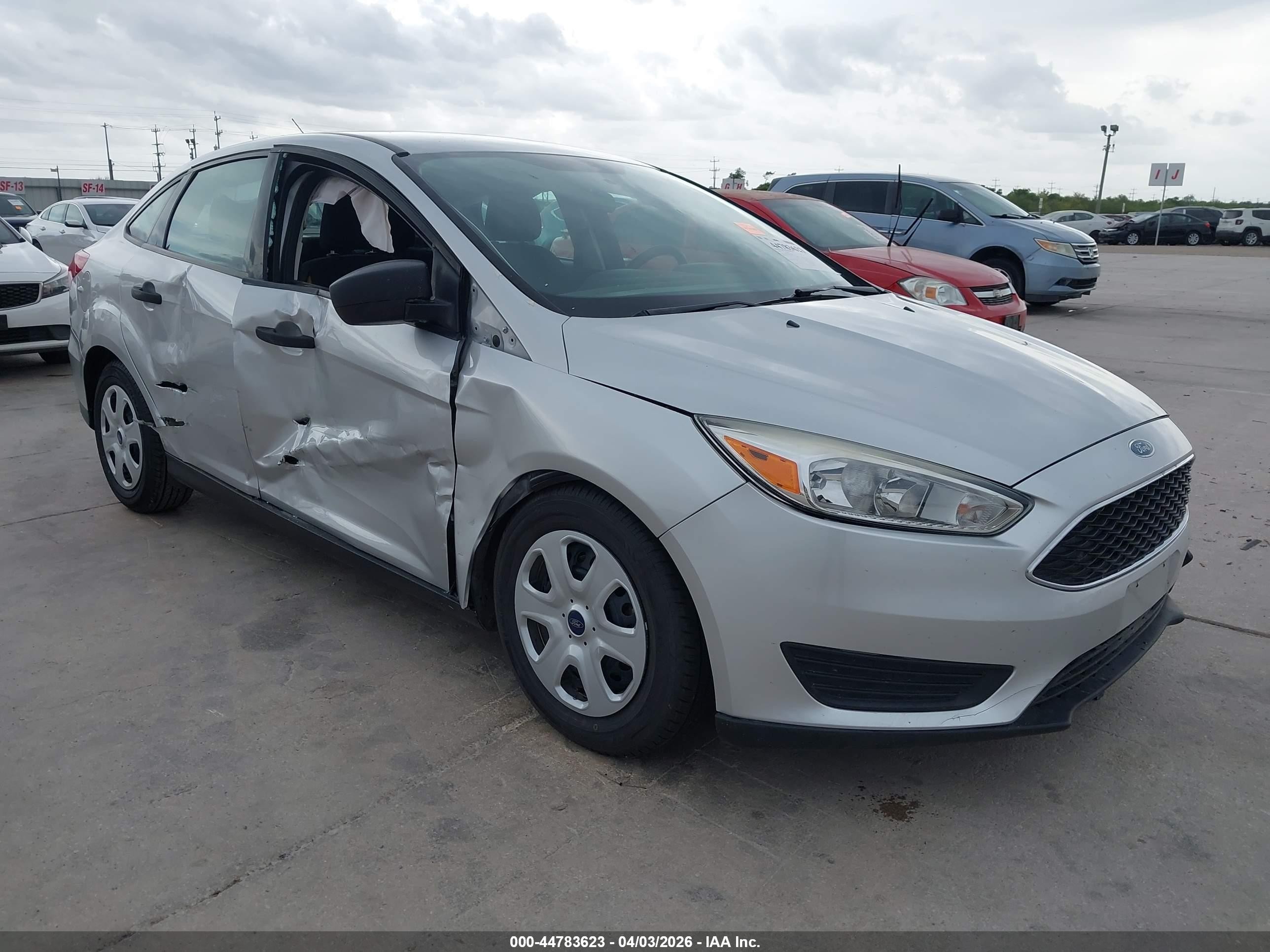 2017 Ford Focus S, VIN 1FADP3E22HL332658 — Side