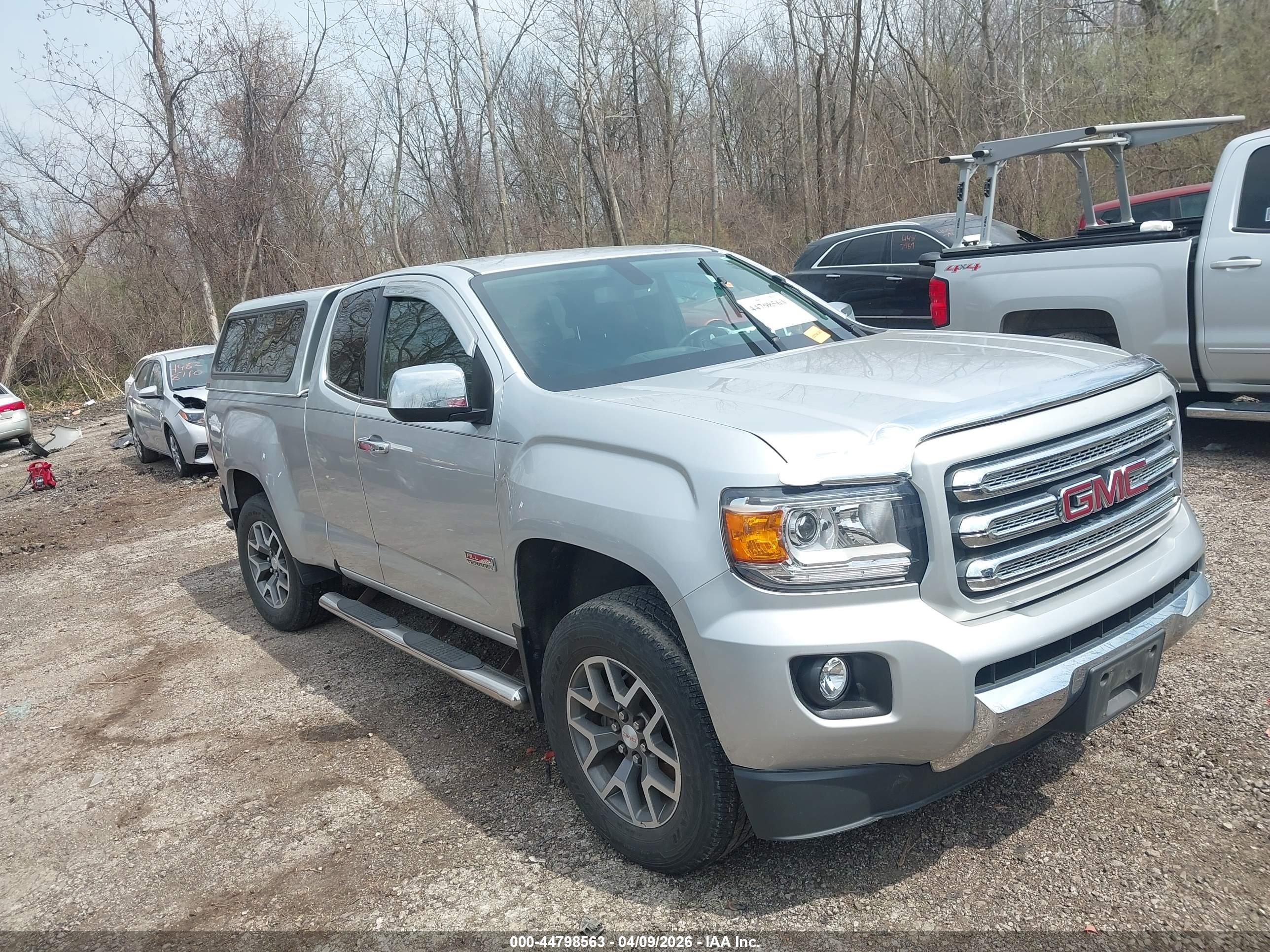 2015 GMC Canyon 4WD SLE, VIN 1GTH6BE31F1244839 — Side
