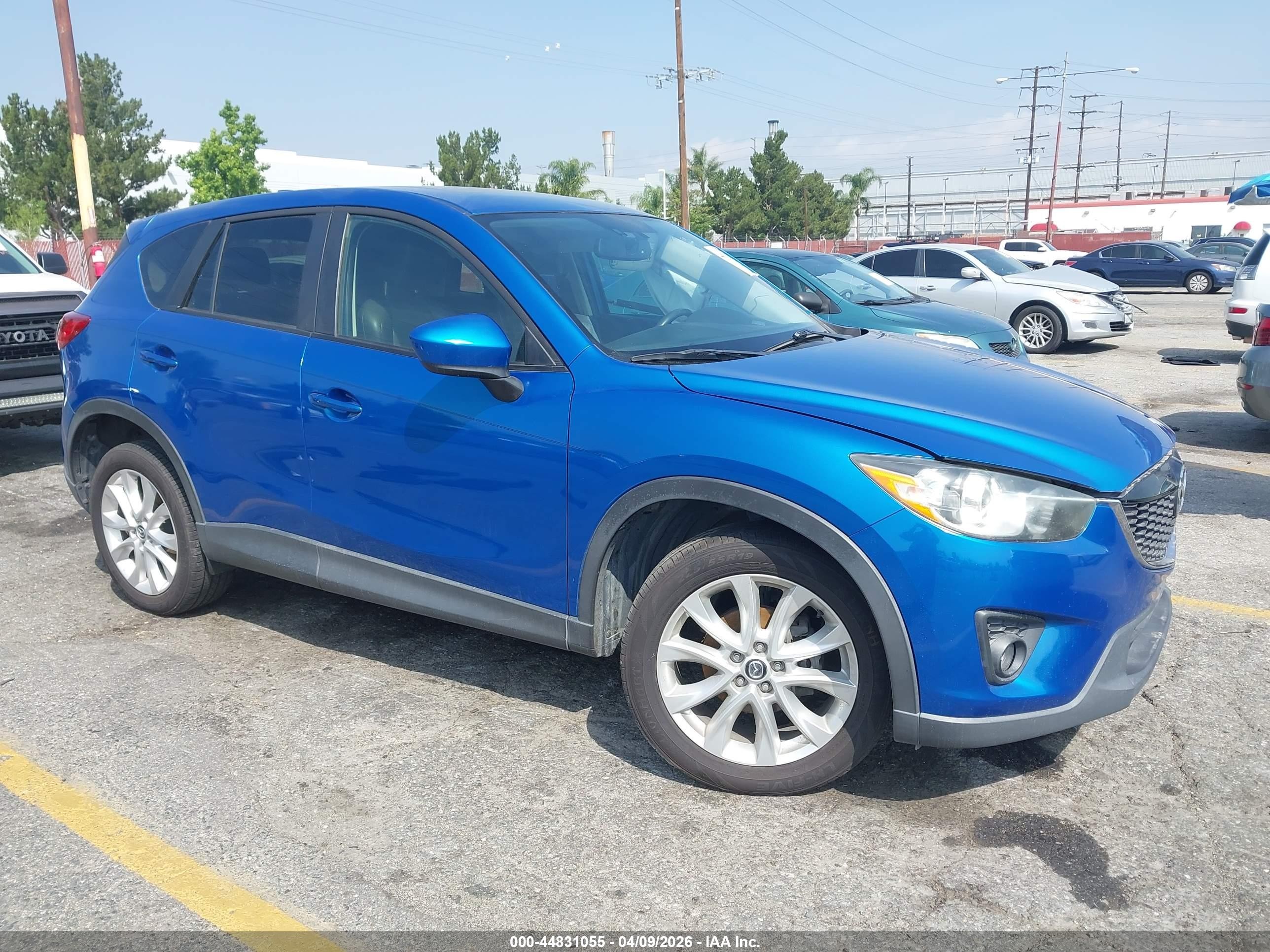 2013 Mazda CX-5 Grand Touring, VIN JM3KE2DE8D0164413 — Side