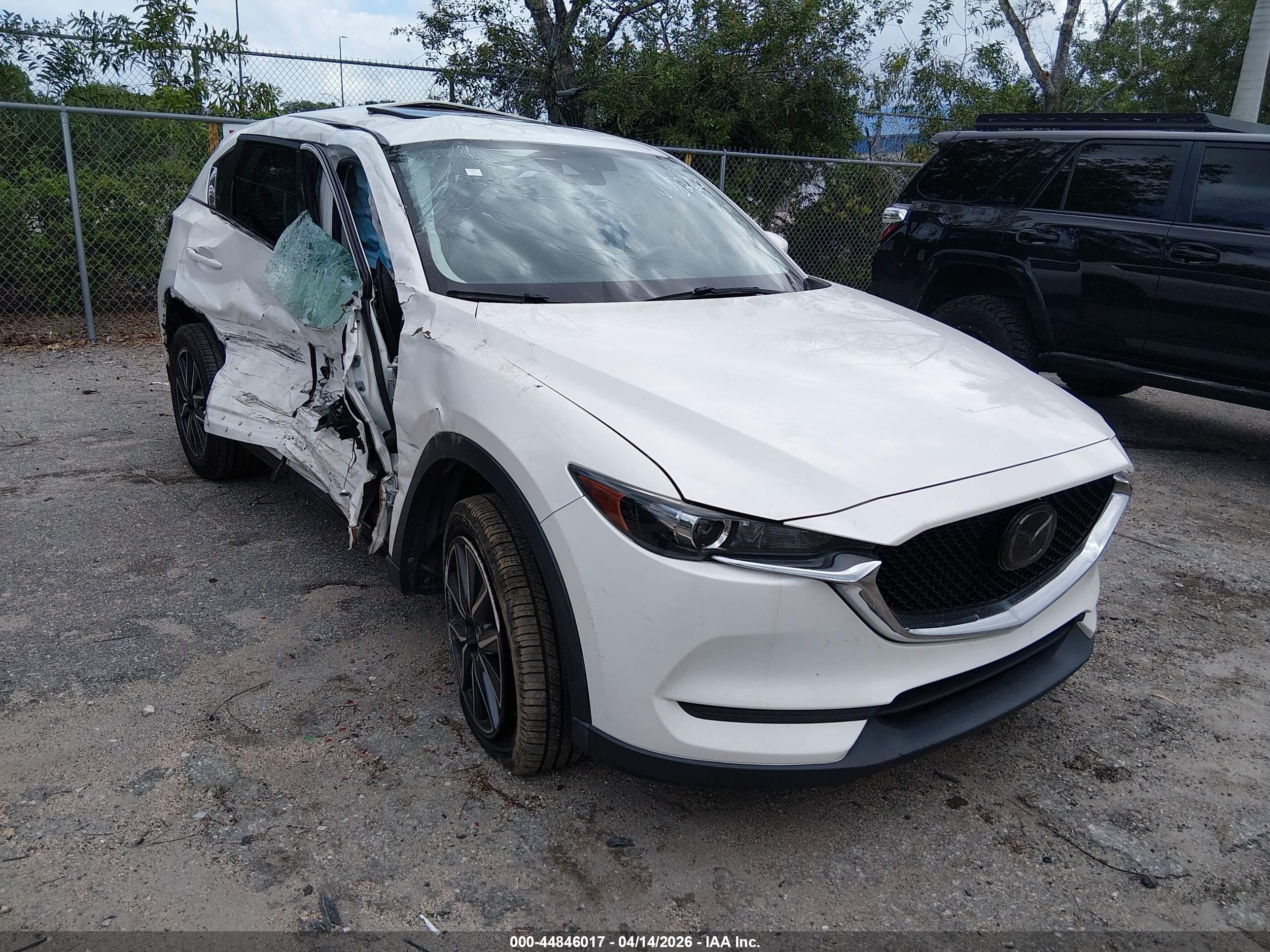 2018 Mazda CX-5 Touring, VIN JM3KFACM3J1358269 — Side