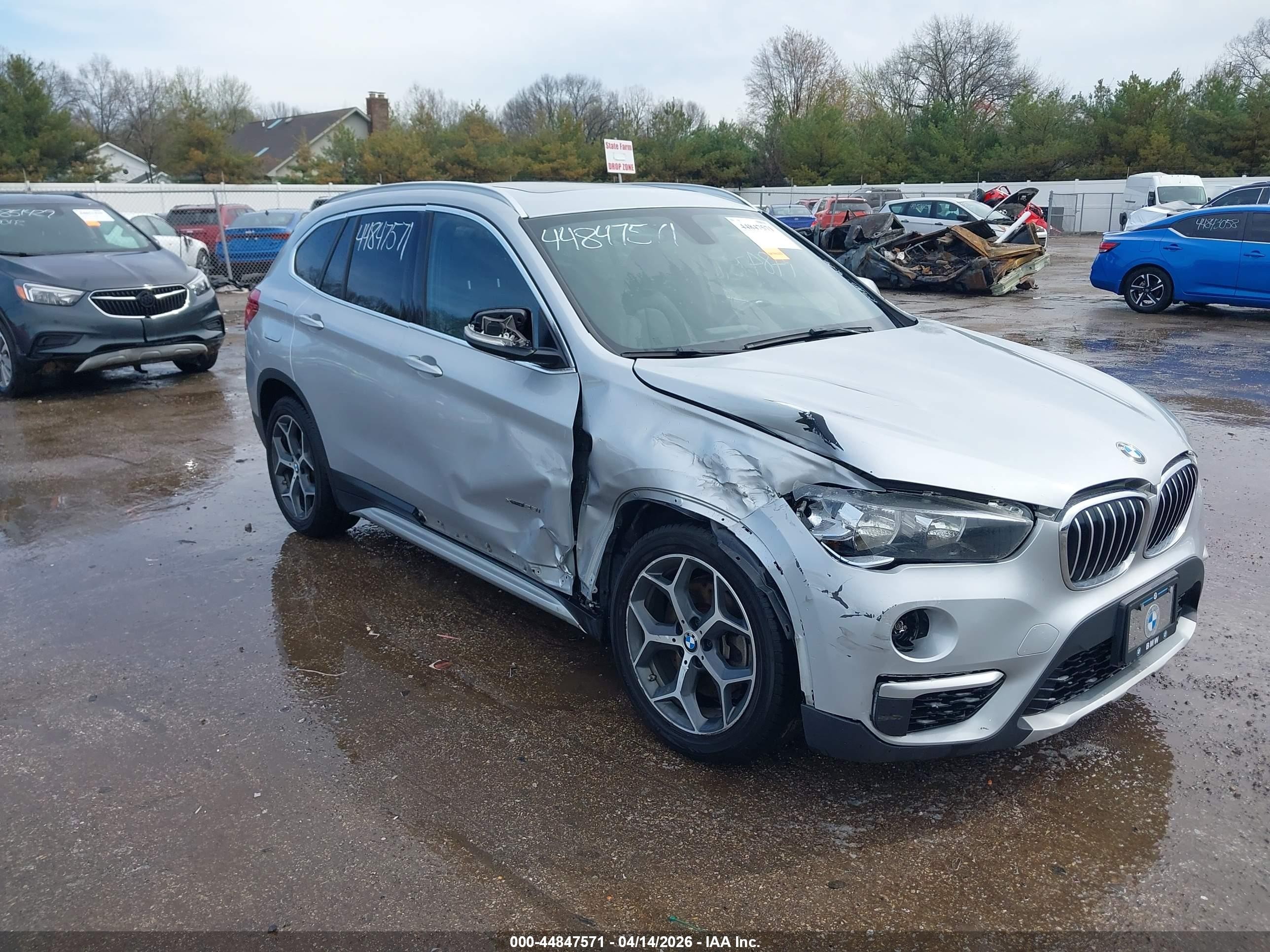 2018 BMW X1 xDrive28i, VIN WBXHT3C39J5K22657 — Side