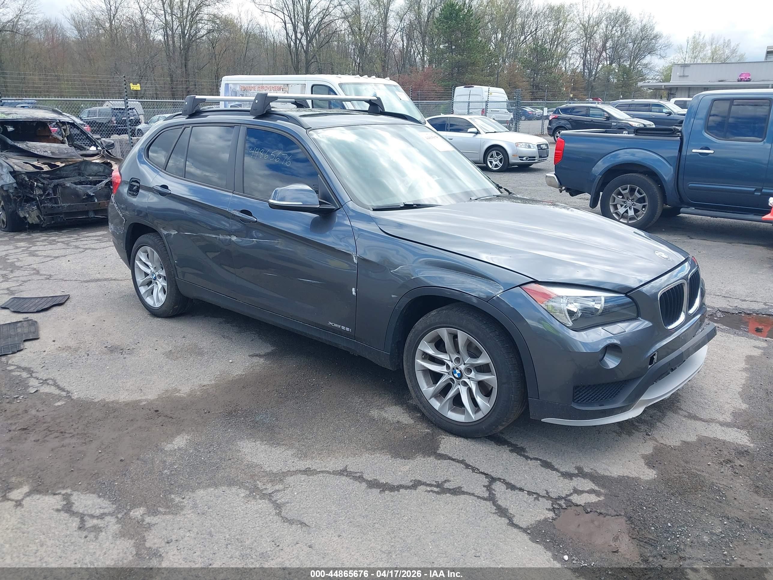 2015 BMW X1 xDrive28i, VIN WBAVL1C55FVY41430 — Side