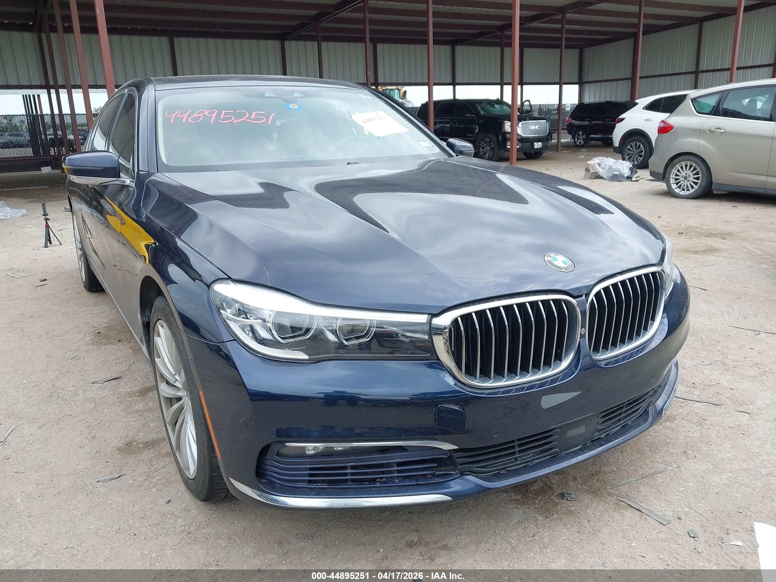 2016 BMW 7 Series 740i, VIN WBA7E2C56GG546822 — Side