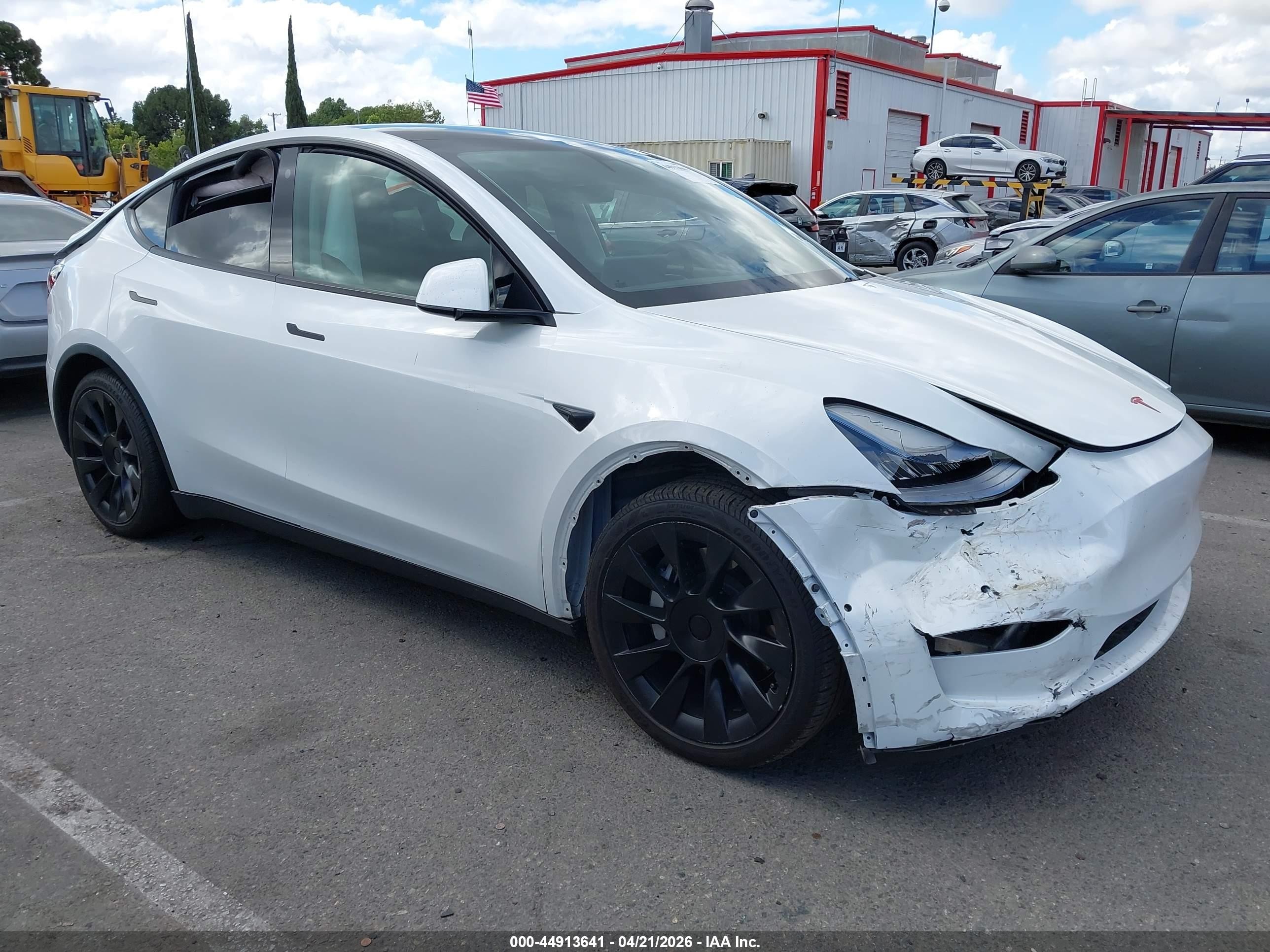 2021 Tesla Model Y Standard Range, VIN 5YJYGDED0MF105923 — Rollover