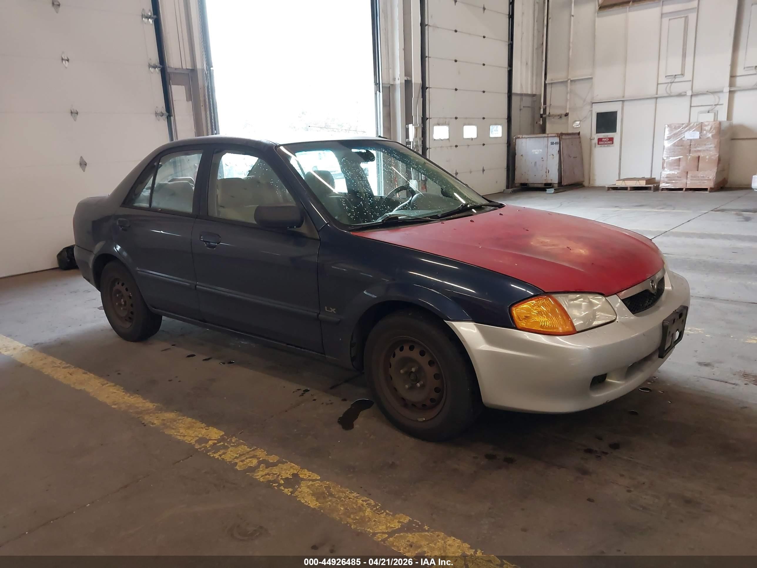 2000 Mazda Protege DX, VIN JM1BJ2223Y0305441 — Side