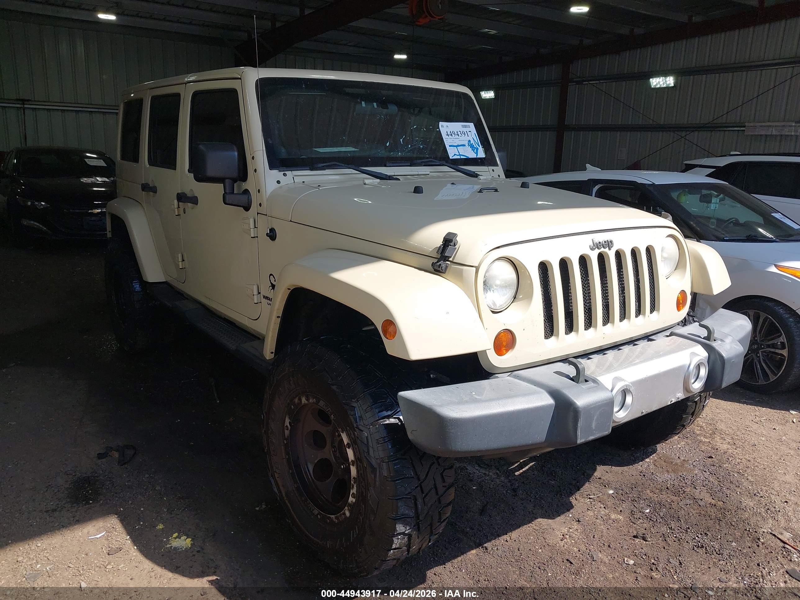 2012 Jeep Wrangler Unlimited Sahara, VIN 1C4BJWEG1CL104000 — Vandalism
