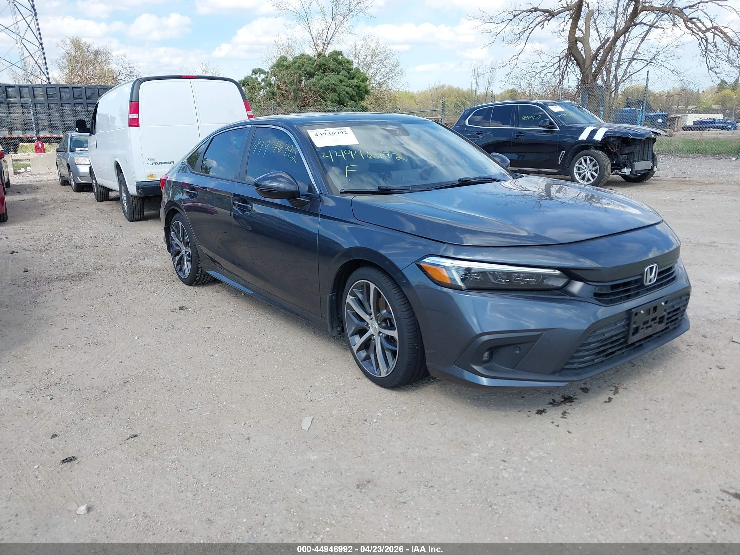 2023 Honda Civic Touring, VIN 2HGFE1F90PH310650 — Storm