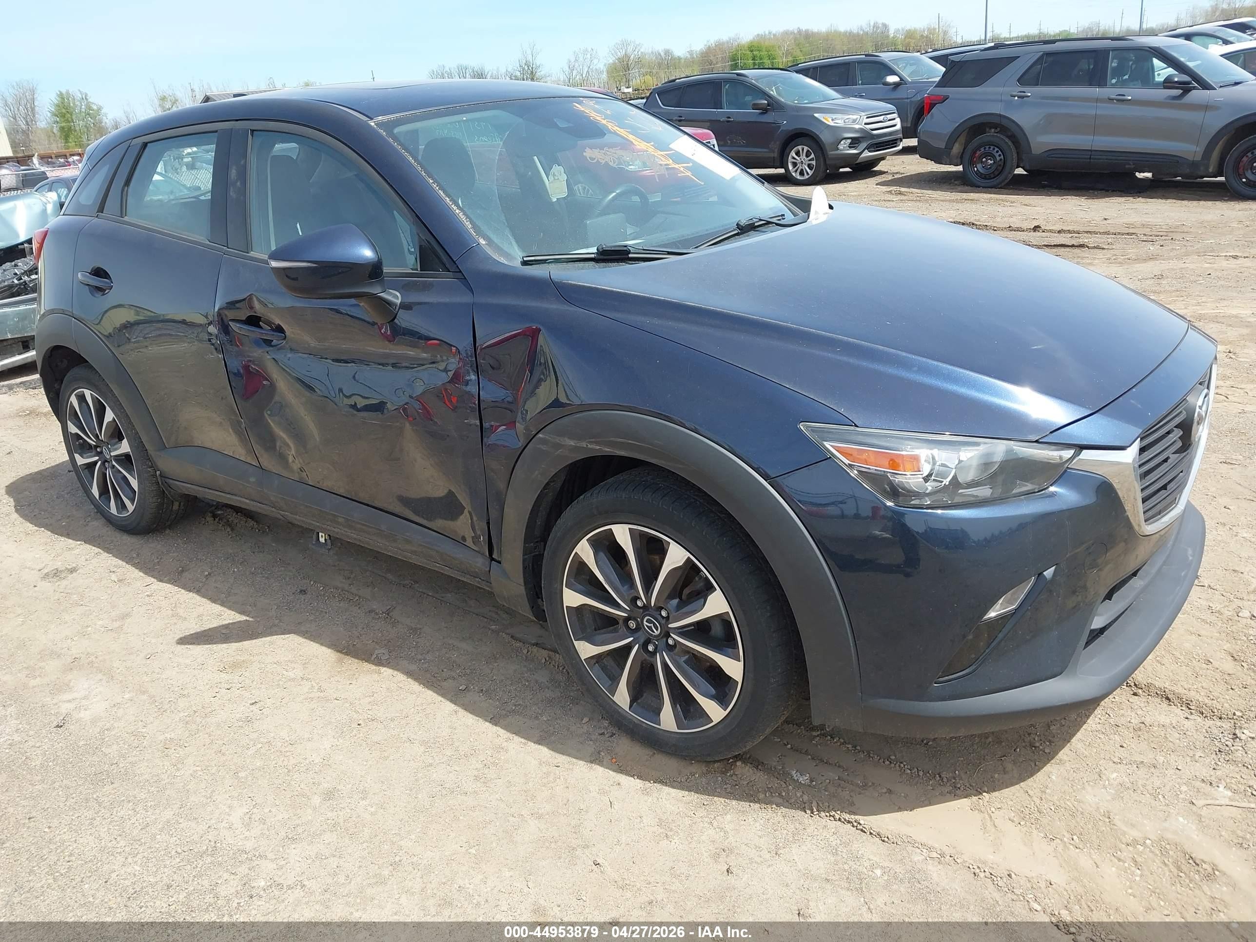 2019 Mazda CX-3 Touring, VIN JM1DKFC78K0410183 — Side
