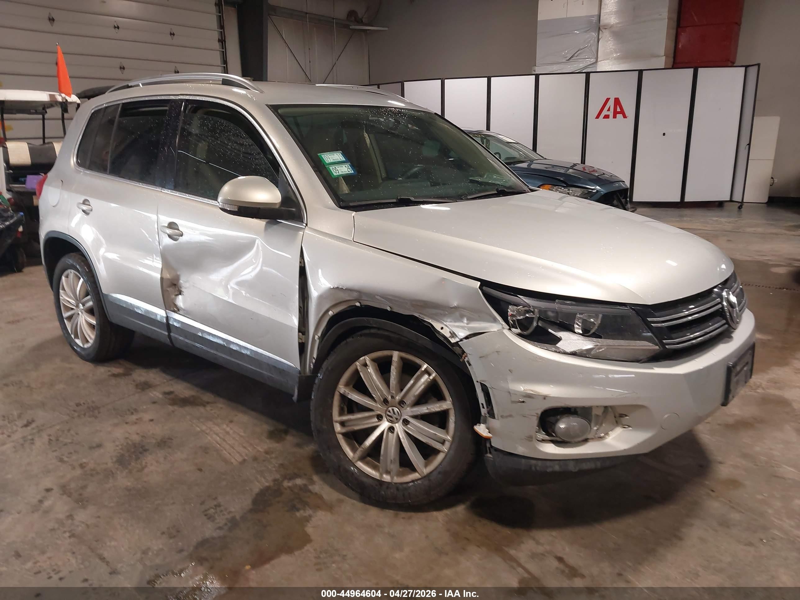 2014 Volkswagen Tiguan S, VIN WVGAV3AX2EW519750 — Side