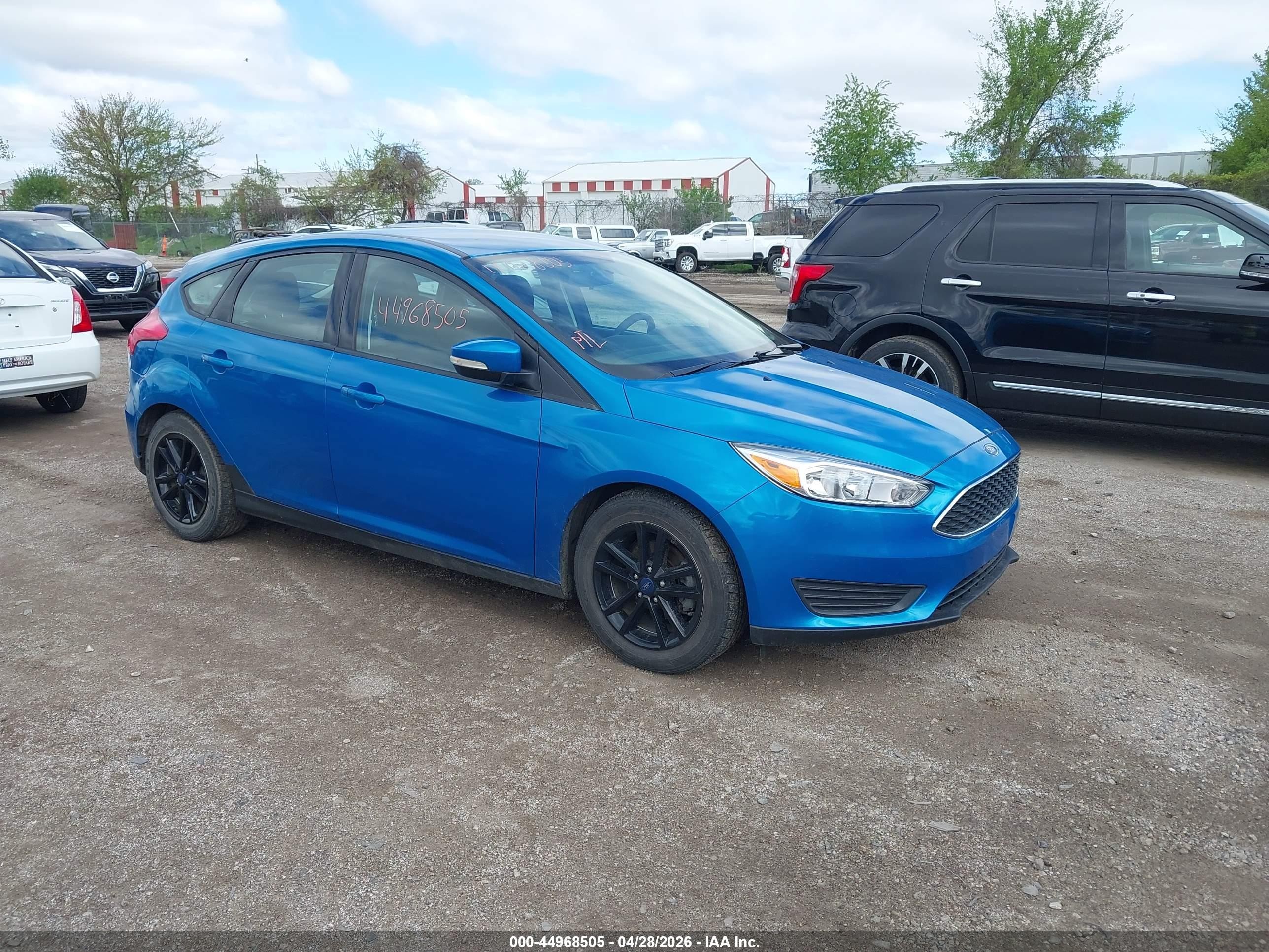 2015 Ford Focus SE, VIN 1FADP3K25FL373108 — Hail