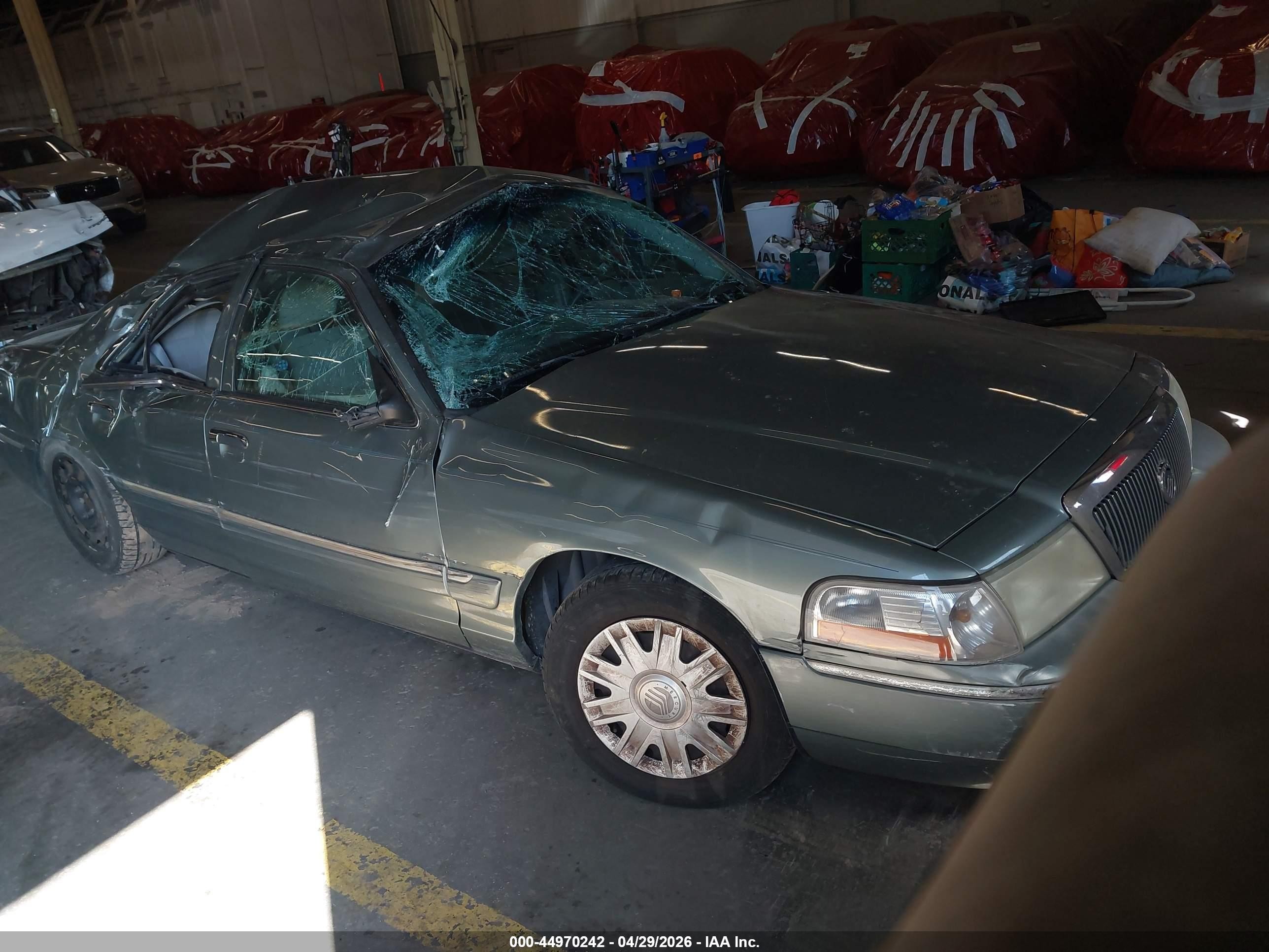 2005 Mercury Grand Marquis GS, VIN 2MEFM74W95X606569 — Rollover