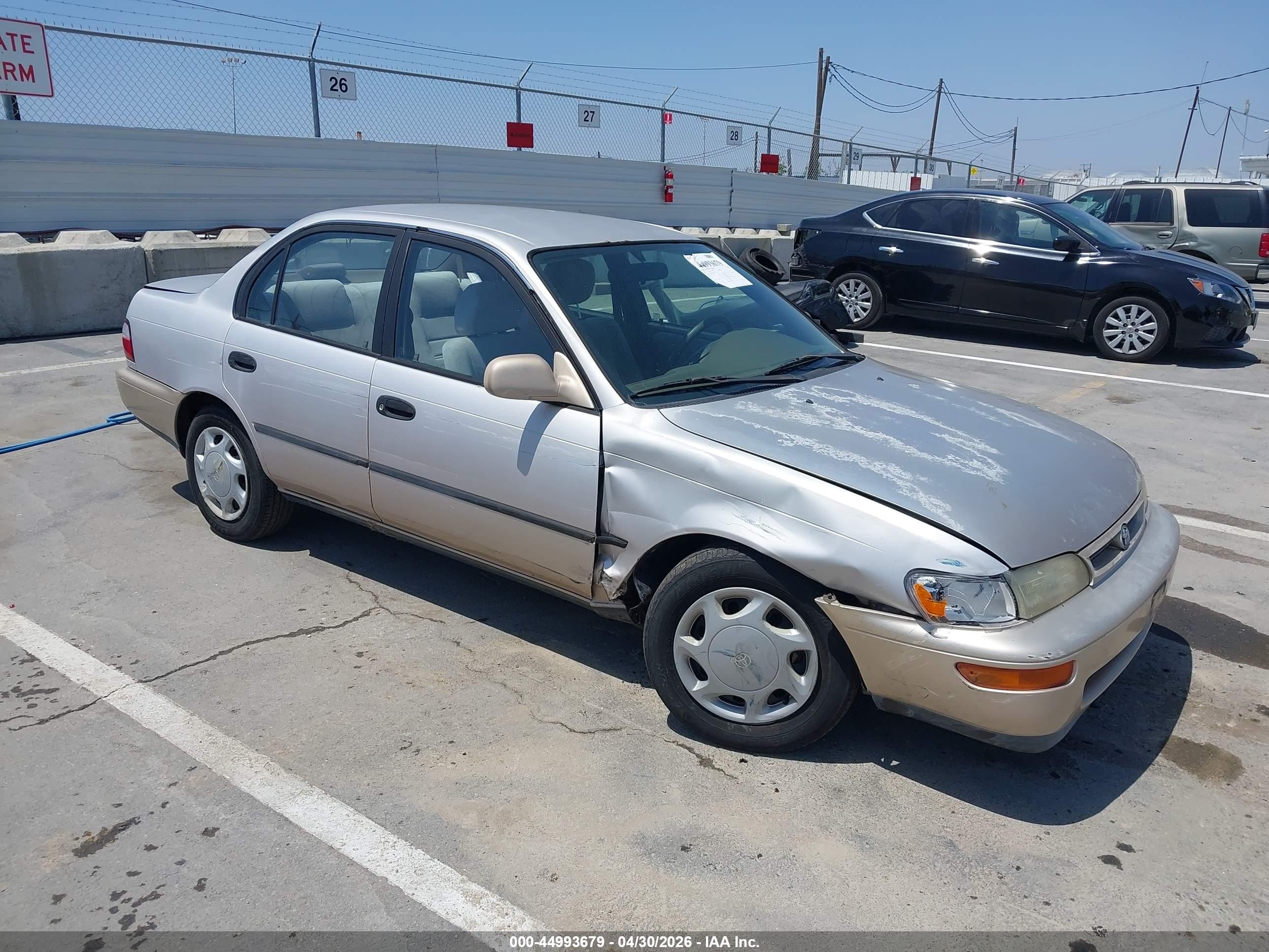 1997 Toyota Corolla DX, VIN 1NXBB02E0VZ527088 — Side