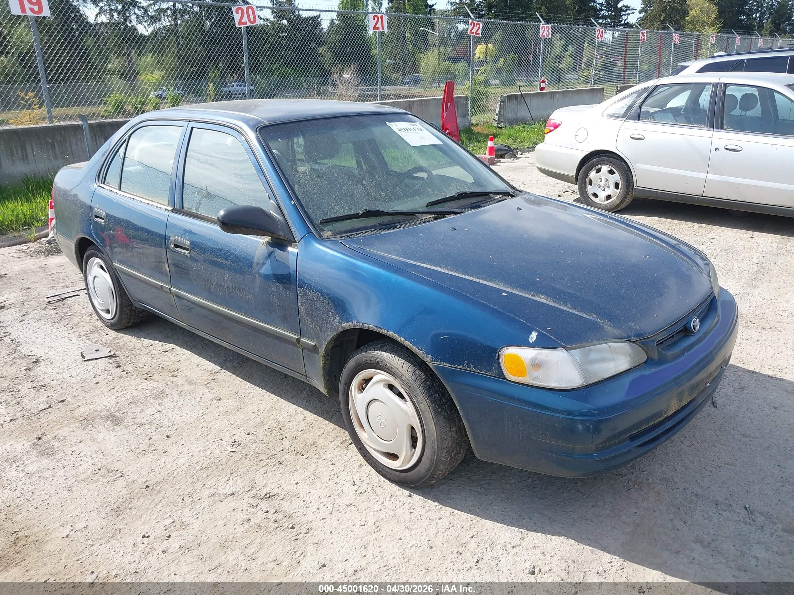 2000 Toyota Corolla CE, VIN 1NXBR12E6YZ417085 — Side