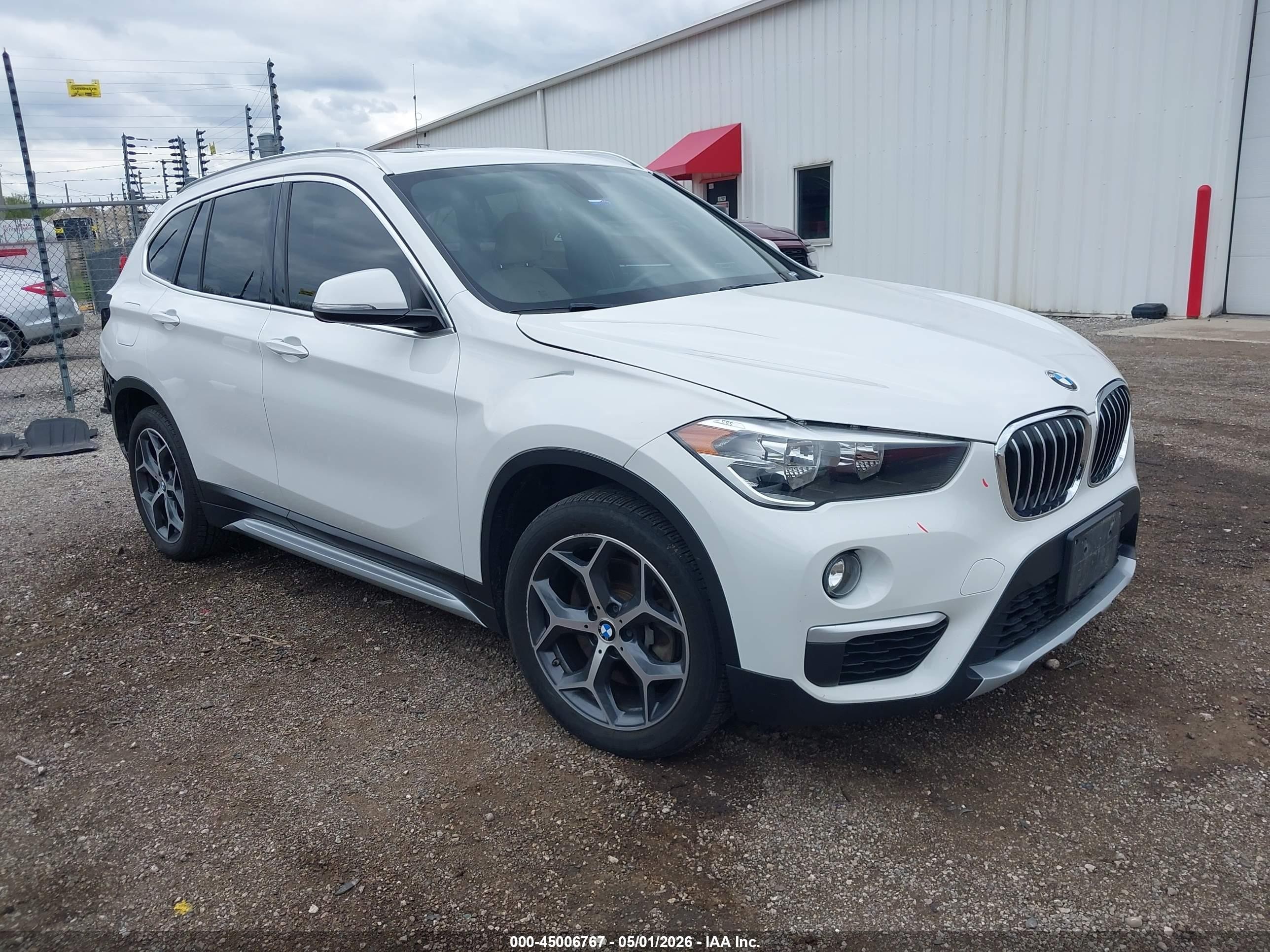 2018 BMW X1 xDrive28i, VIN WBXHT3C33J5L27601 — Rear end