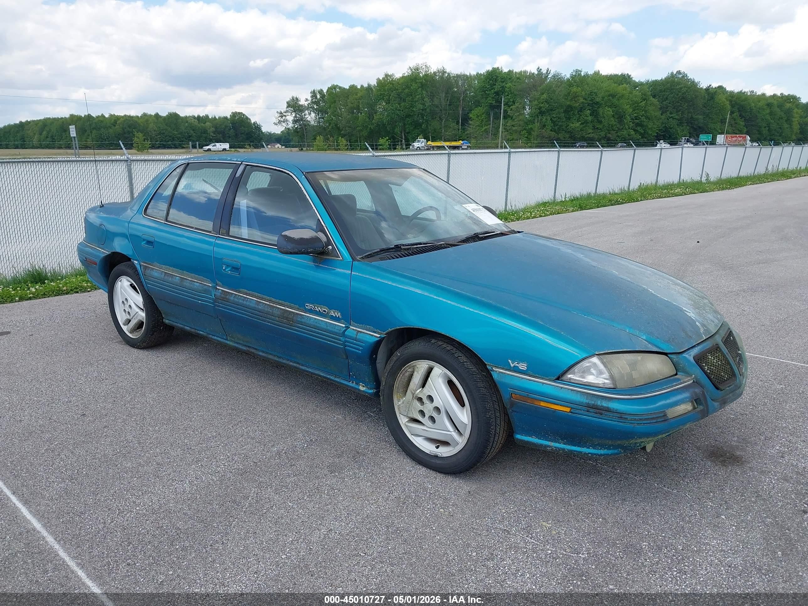 1994 Pontiac Grand Am SE, VIN 1G2NE55M9RM539324 — Normal wear