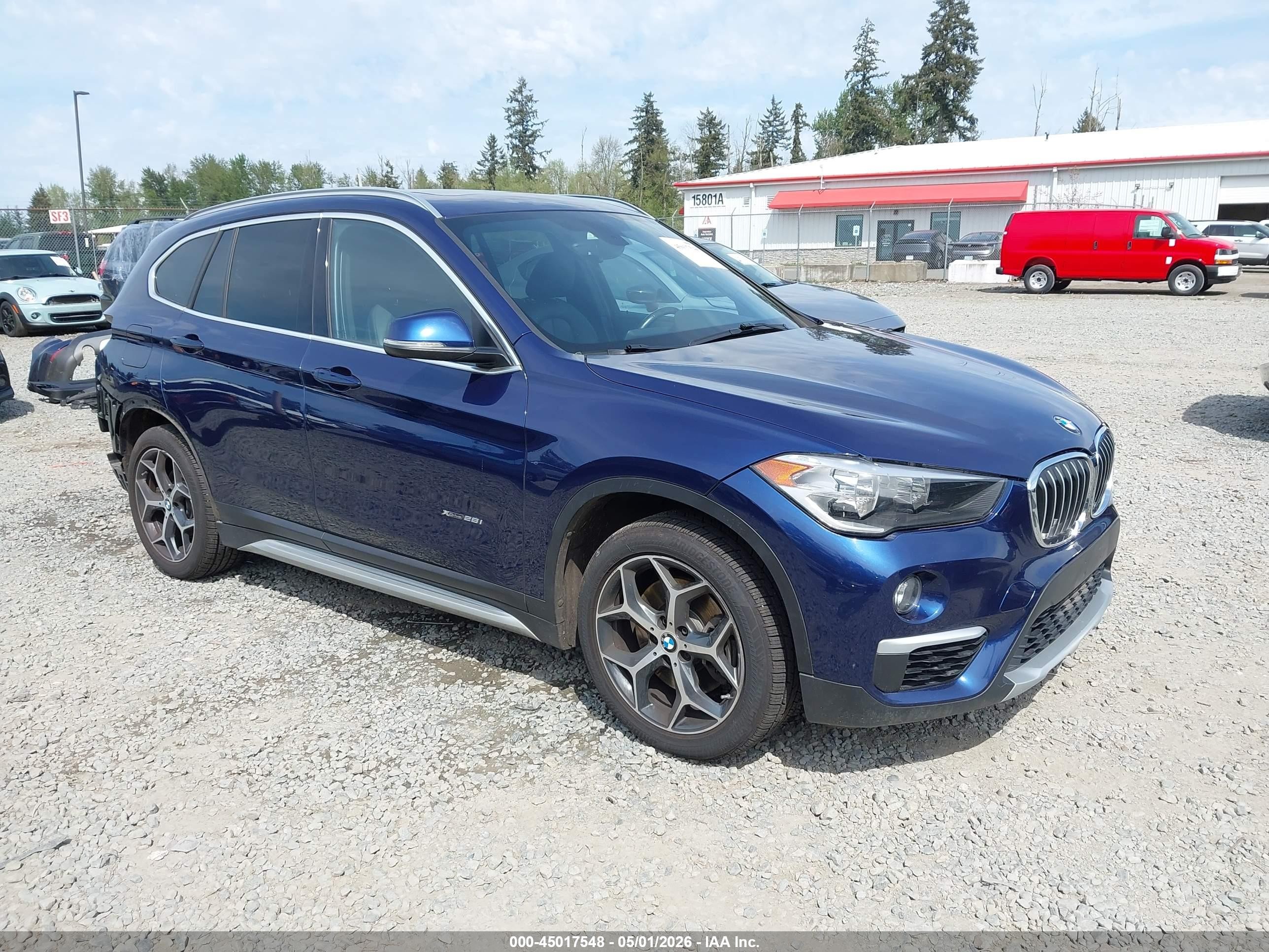 2018 BMW X1 xDrive28i, VIN WBXHT3C34J5L24240 — Rear end