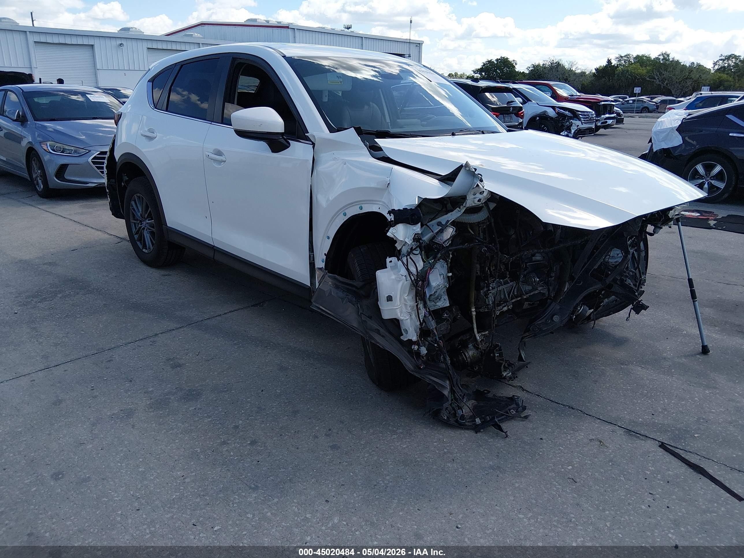 2020 Mazda CX-5 Touring, VIN JM3KFACM3L0801531 — Front end