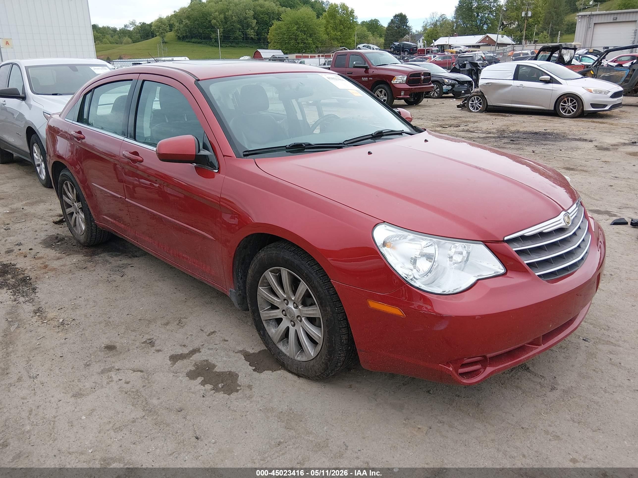 2010 Chrysler Sebring Limited, VIN 1C3CC5FB9AN166360 — Side