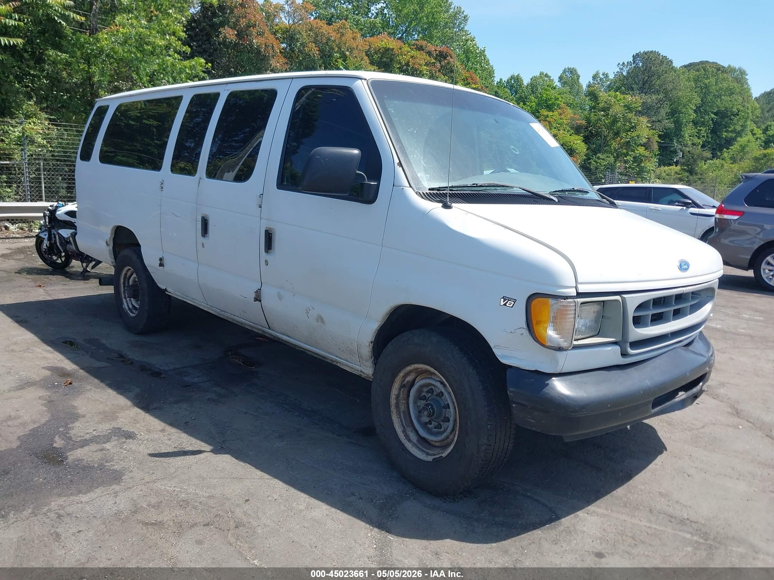 1997 Ford Econoline Wagon XL, VIN 1FBJS31L8VHA56323 — Side