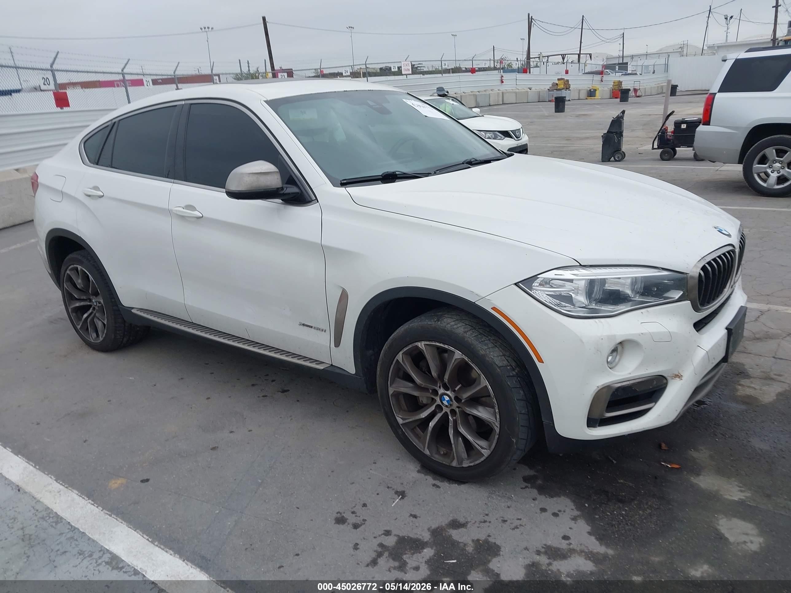 2016 BMW X6 xDrive50i, VIN 5UXKU6C52G0R34158 — Side