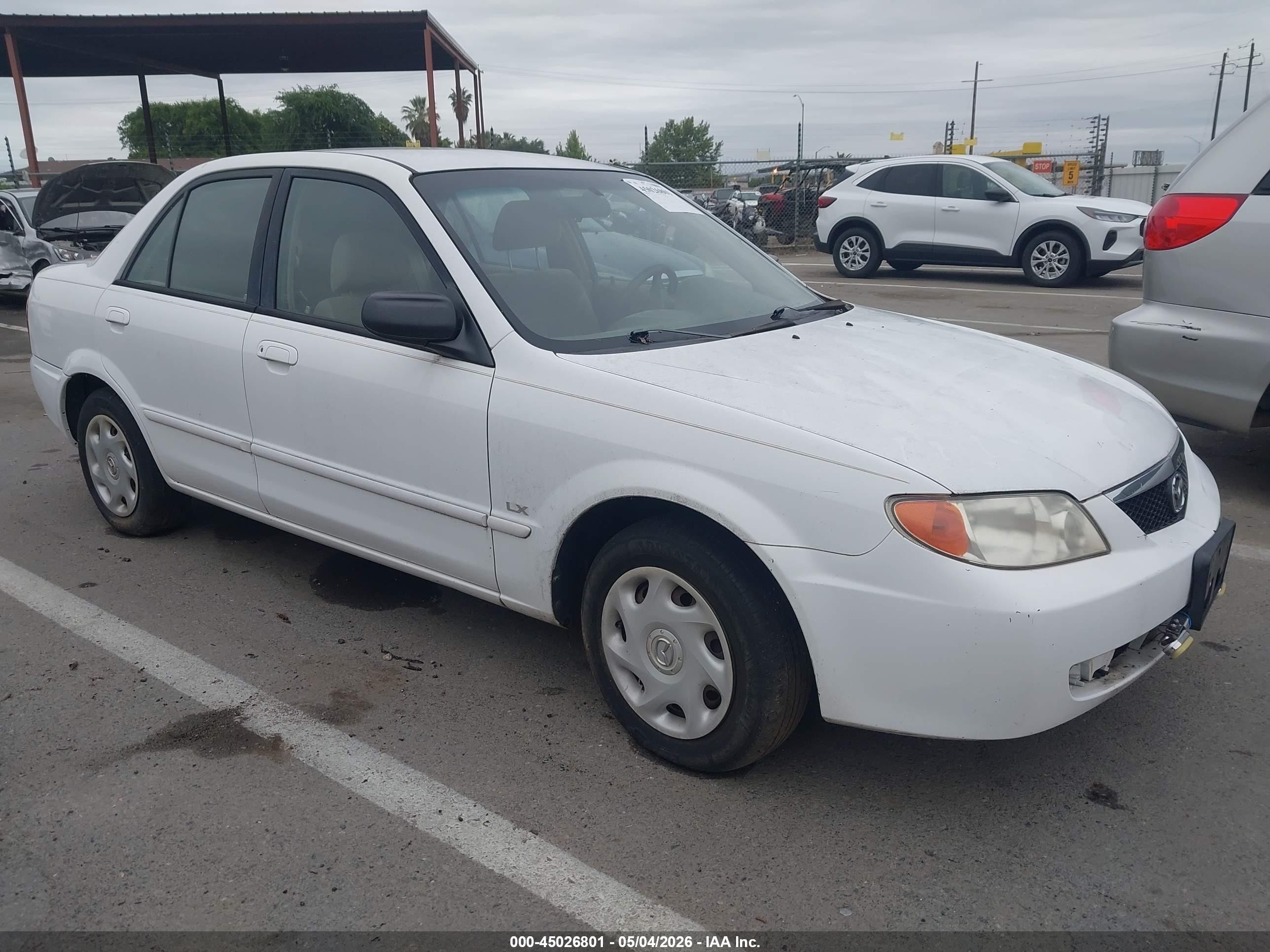 2001 Mazda Protege DX, VIN JM1BJ222210454218 — Обычный износ