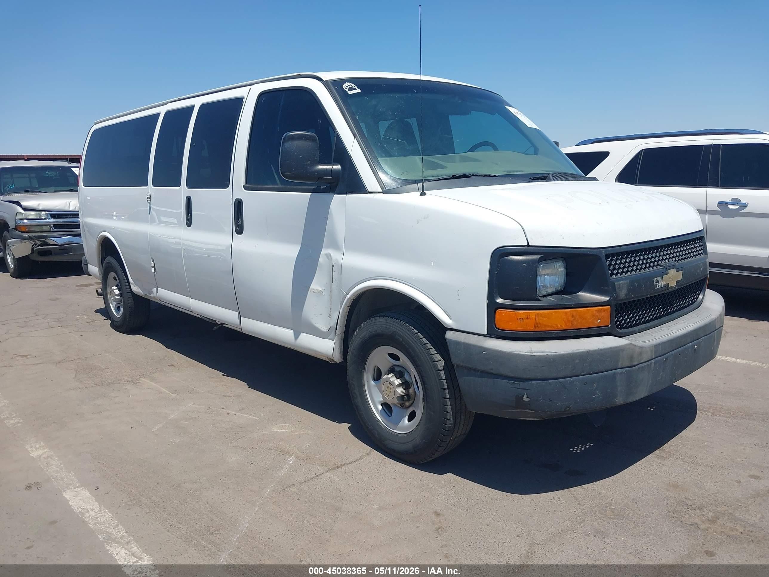 2013 Chevrolet Express Passenger 1LS, VIN 1GAZGZFG0D1160366 — Side