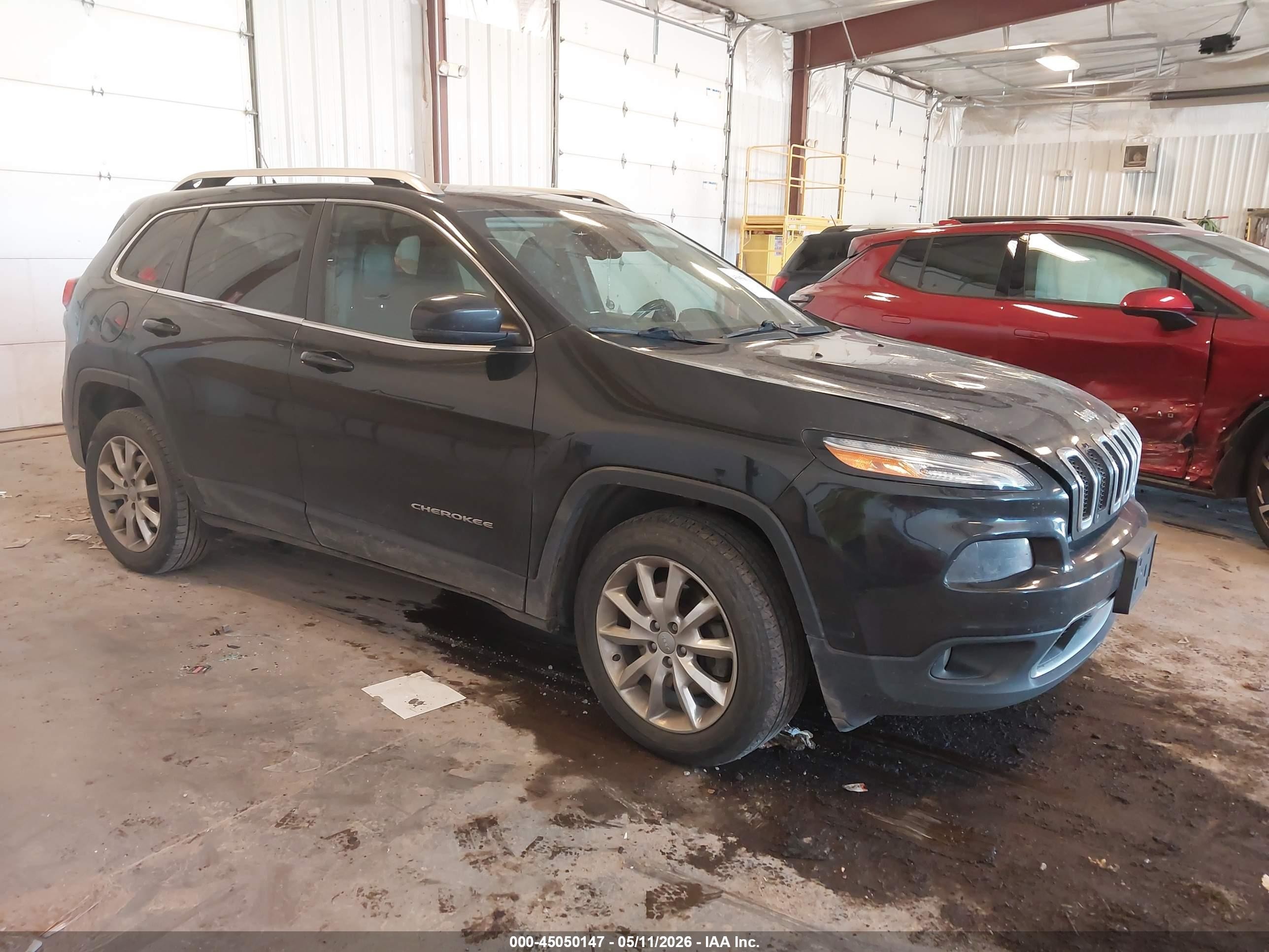 2015 Jeep Cherokee Limited, VIN 1C4PJMDS6FW685738 — Side