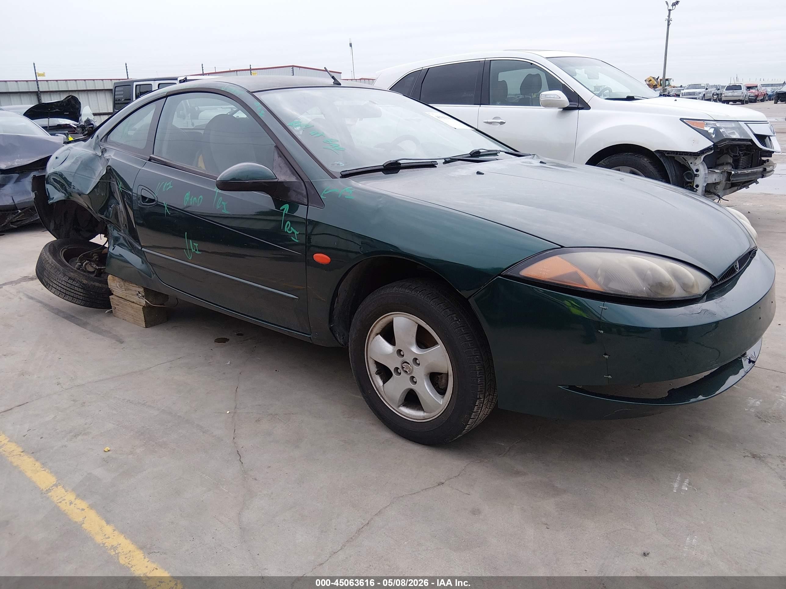 1999 Mercury Cougar, VIN 1ZWHT61LXX5628319 — Бок