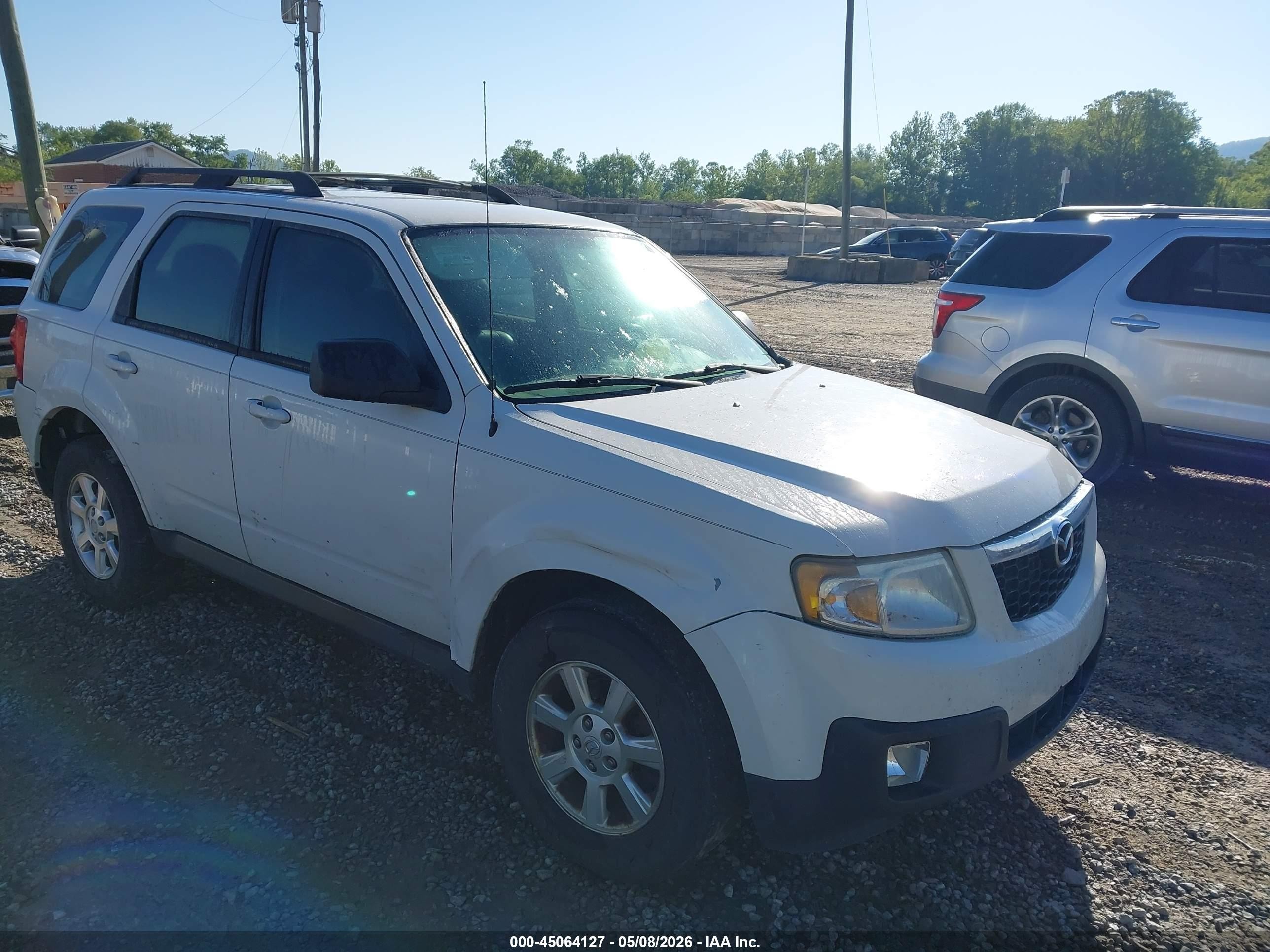 2010 Mazda Tribute Touring, VIN 4F2CY0C7XAKM08526 — Side