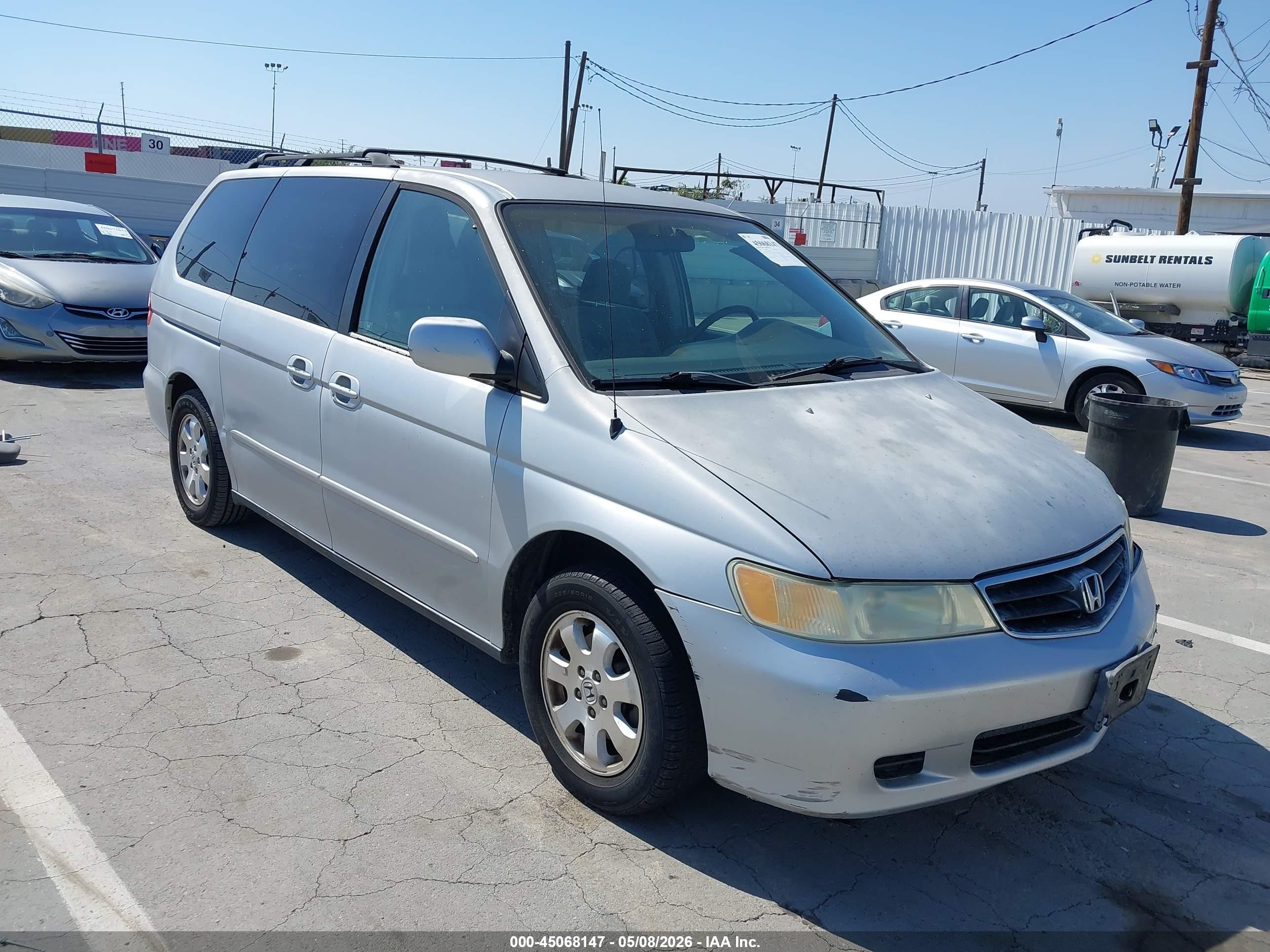 2002 Honda Odyssey EX, VIN 2HKRL18682H522863 — Бок