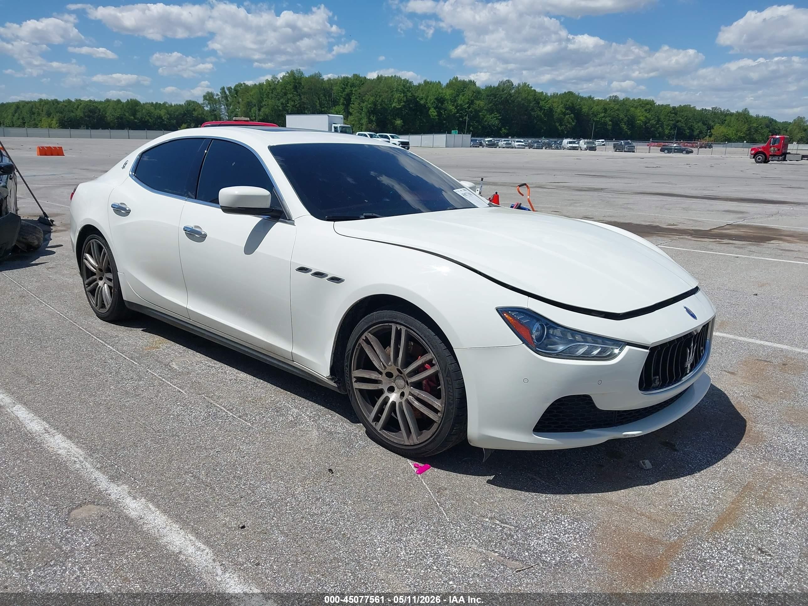 2014 Maserati Ghibli S Q4, VIN ZAM57RTA1E1109736 — Side