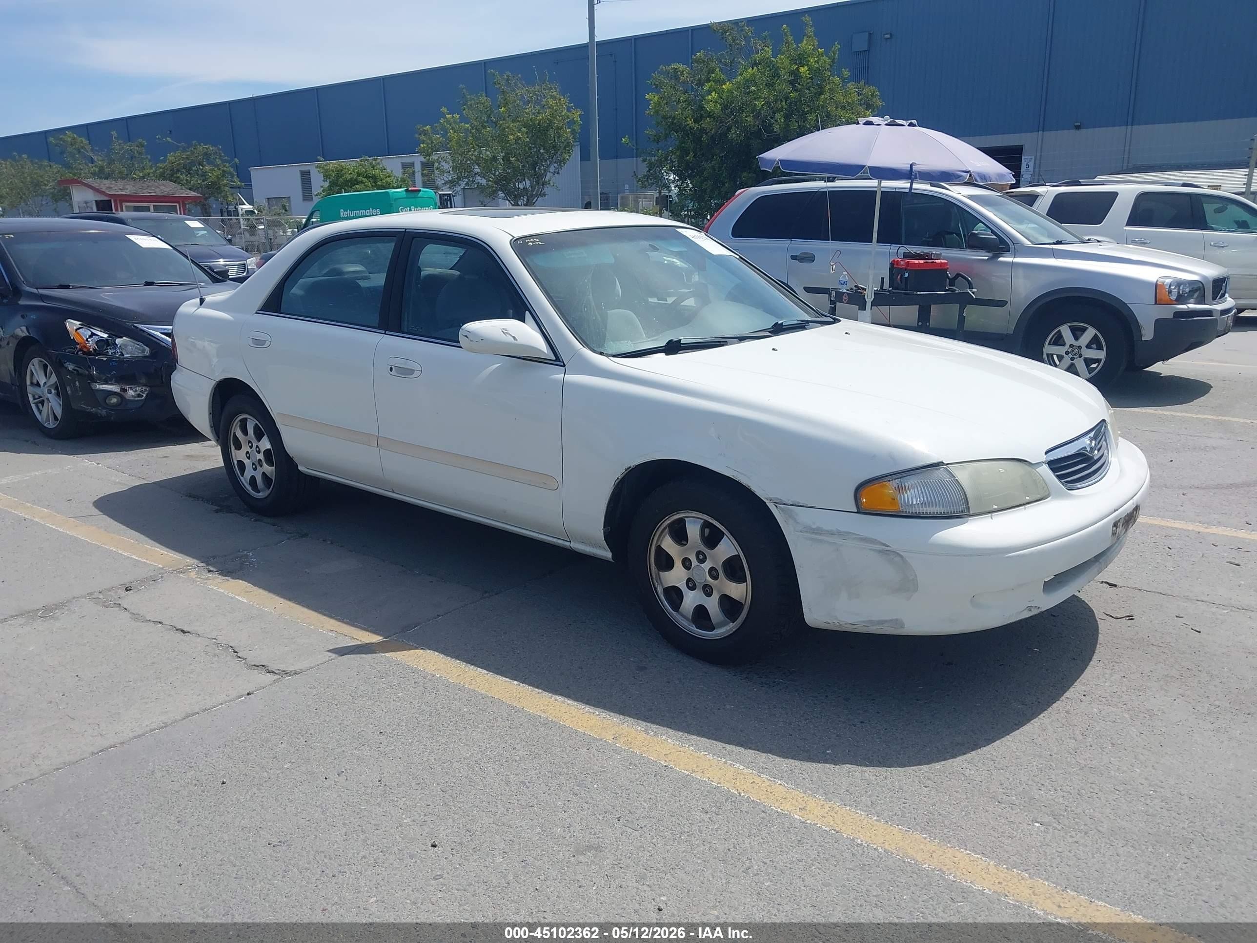 1999 Mazda 626 LX, VIN 1YVGF22D4X5864680 — Side