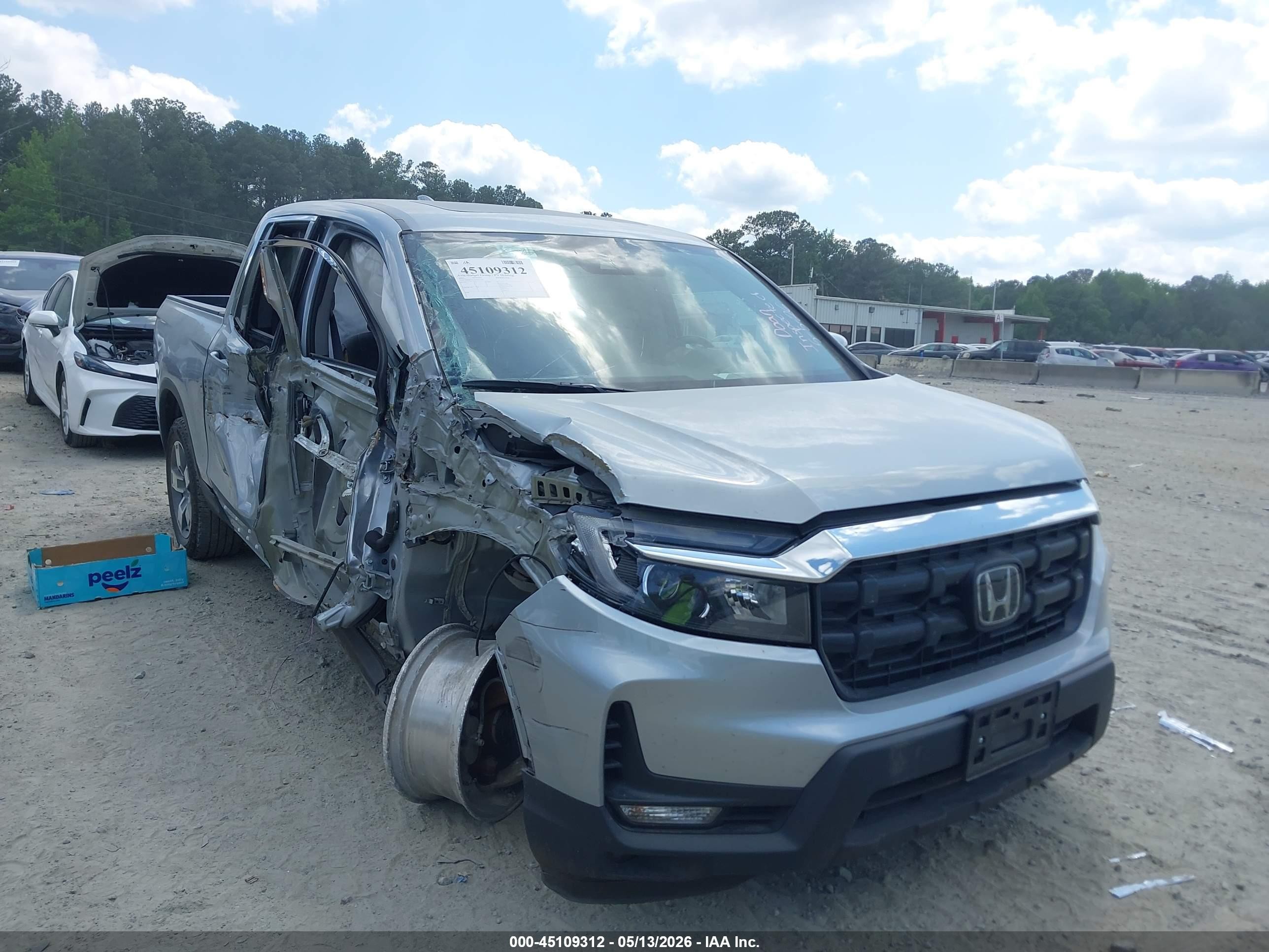 2025 Honda Ridgeline RTL, VIN 5FPYK3F55SB042399 — Side