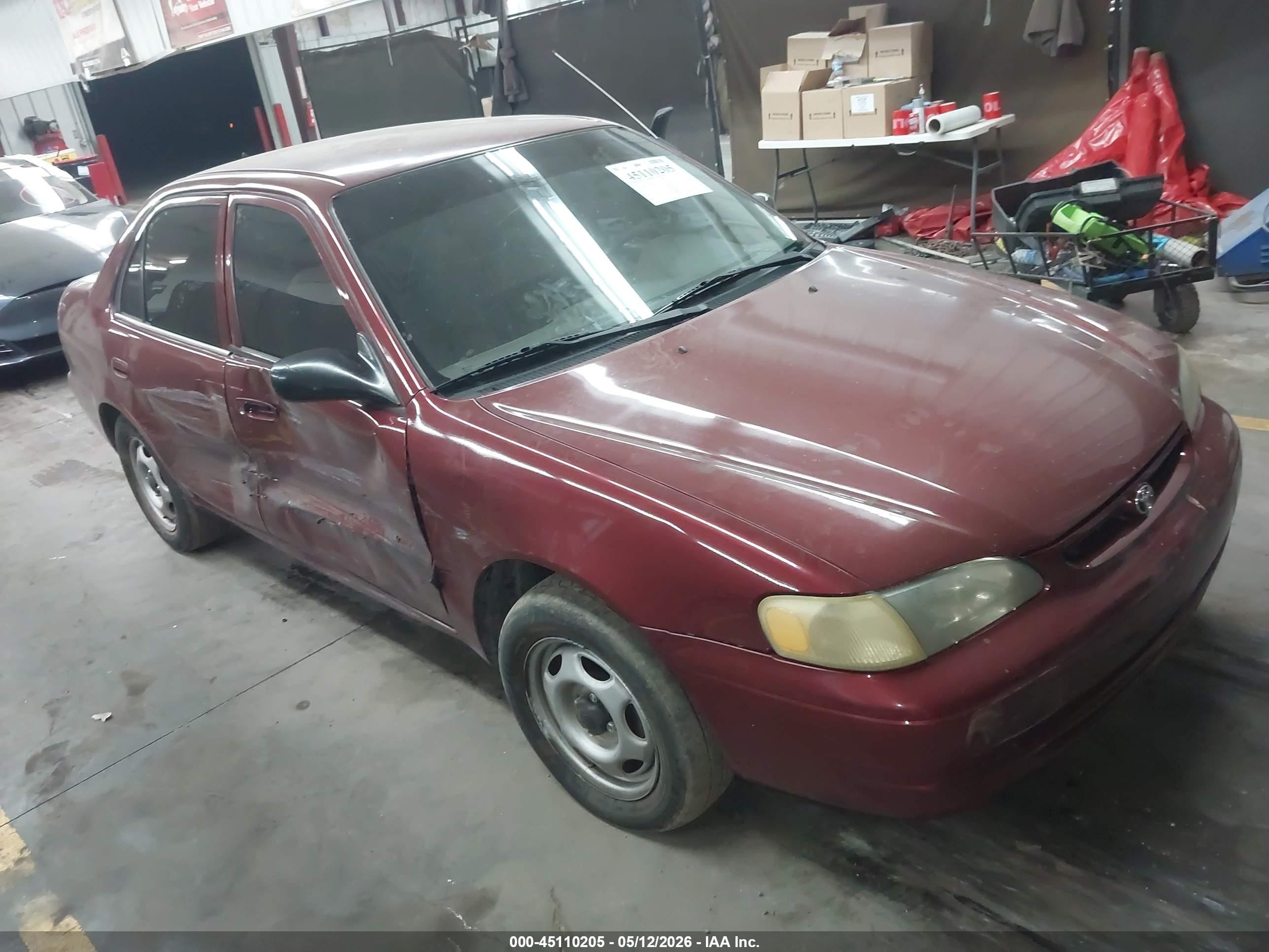 2000 Toyota Corolla CE, VIN 1NXBR12E2YZ401479 — Side