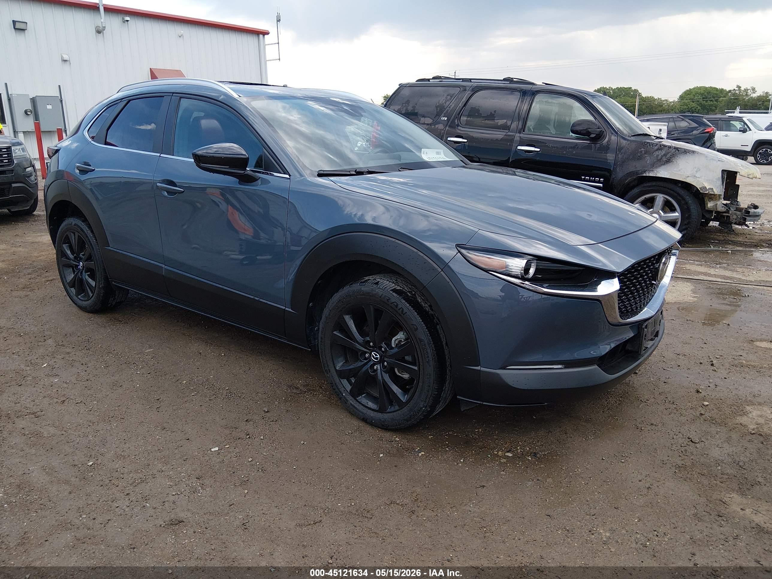 2023 Mazda CX-30 S Carbon Edition, VIN 3MVDMBCM3PM513703 — Hail