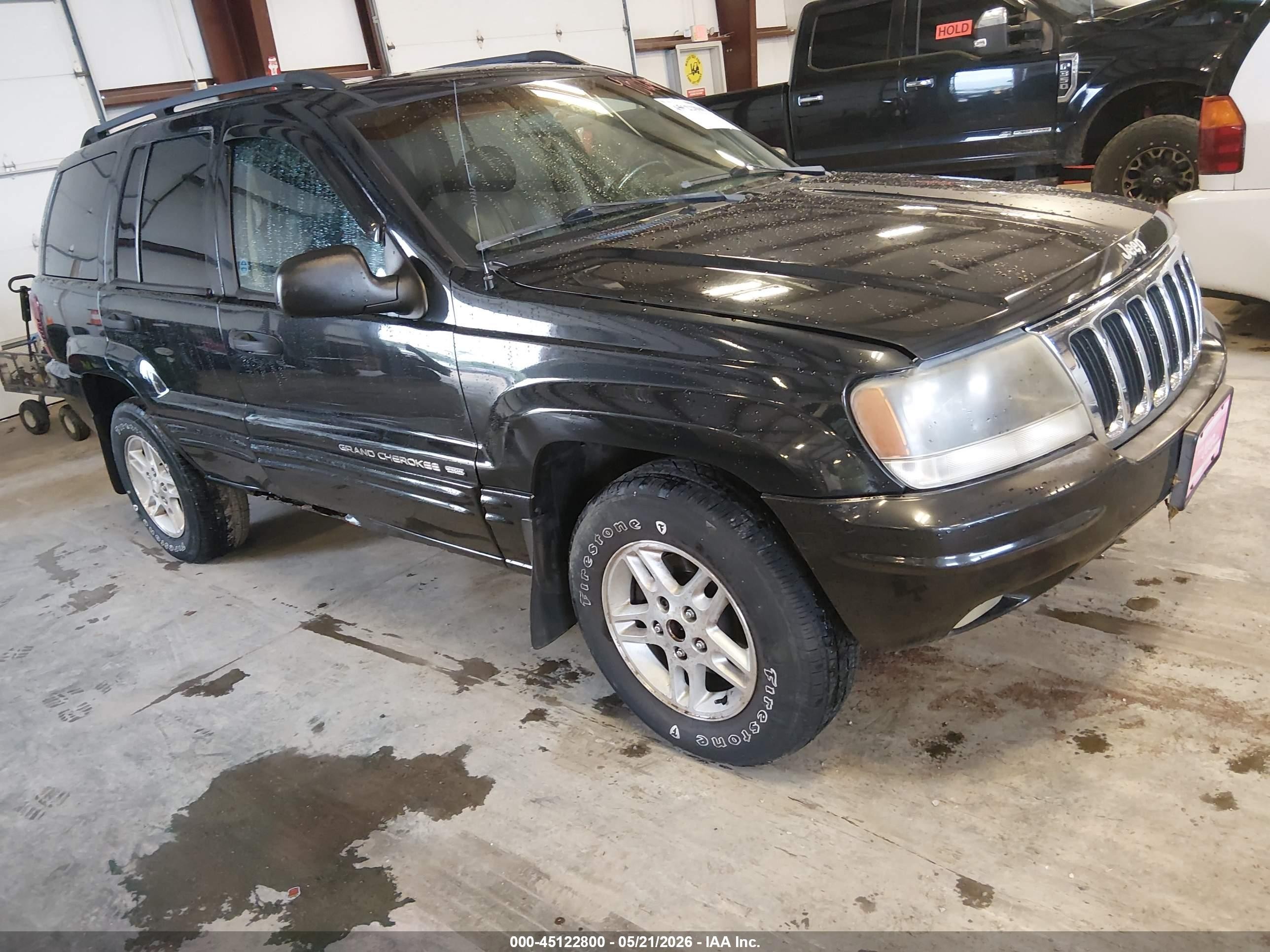 2002 Jeep Grand Cherokee Laredo, VIN 1J4GW48S12C319901 — Фото с аукциона 1 of 5
