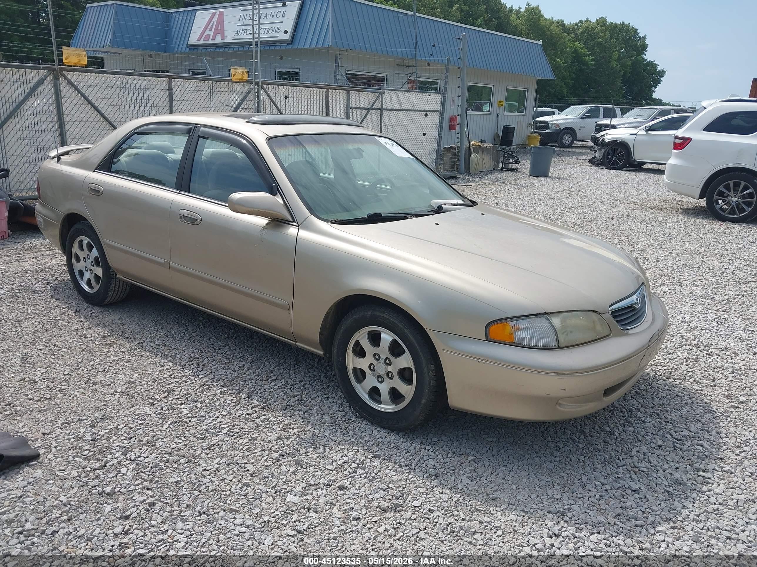 1999 Mazda 626 ES, VIN 1YVGF22C6X5888020 — Normal wear