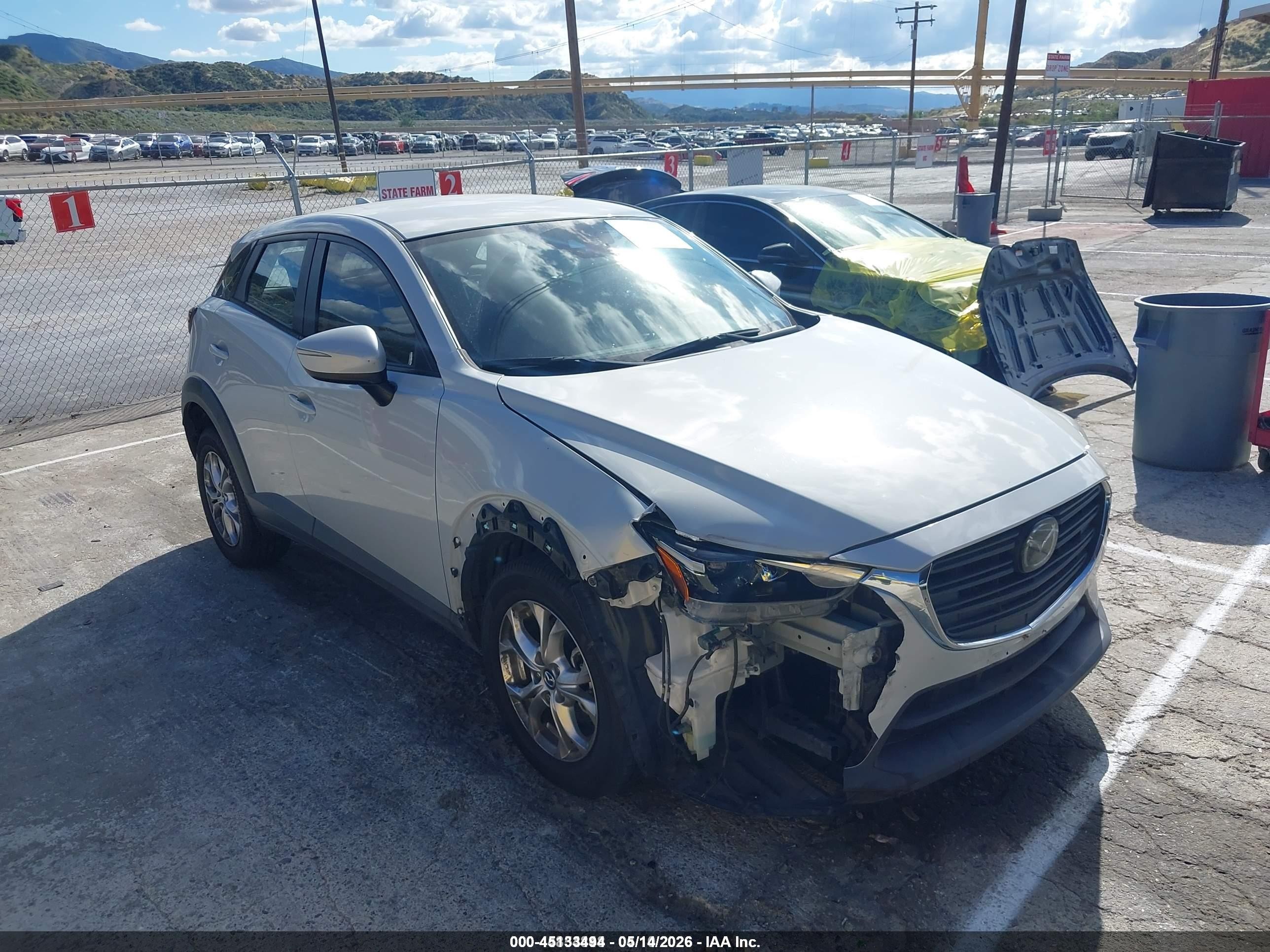 2021 Mazda CX-3 Sport, VIN JM1DKDB70M1500172 — Side