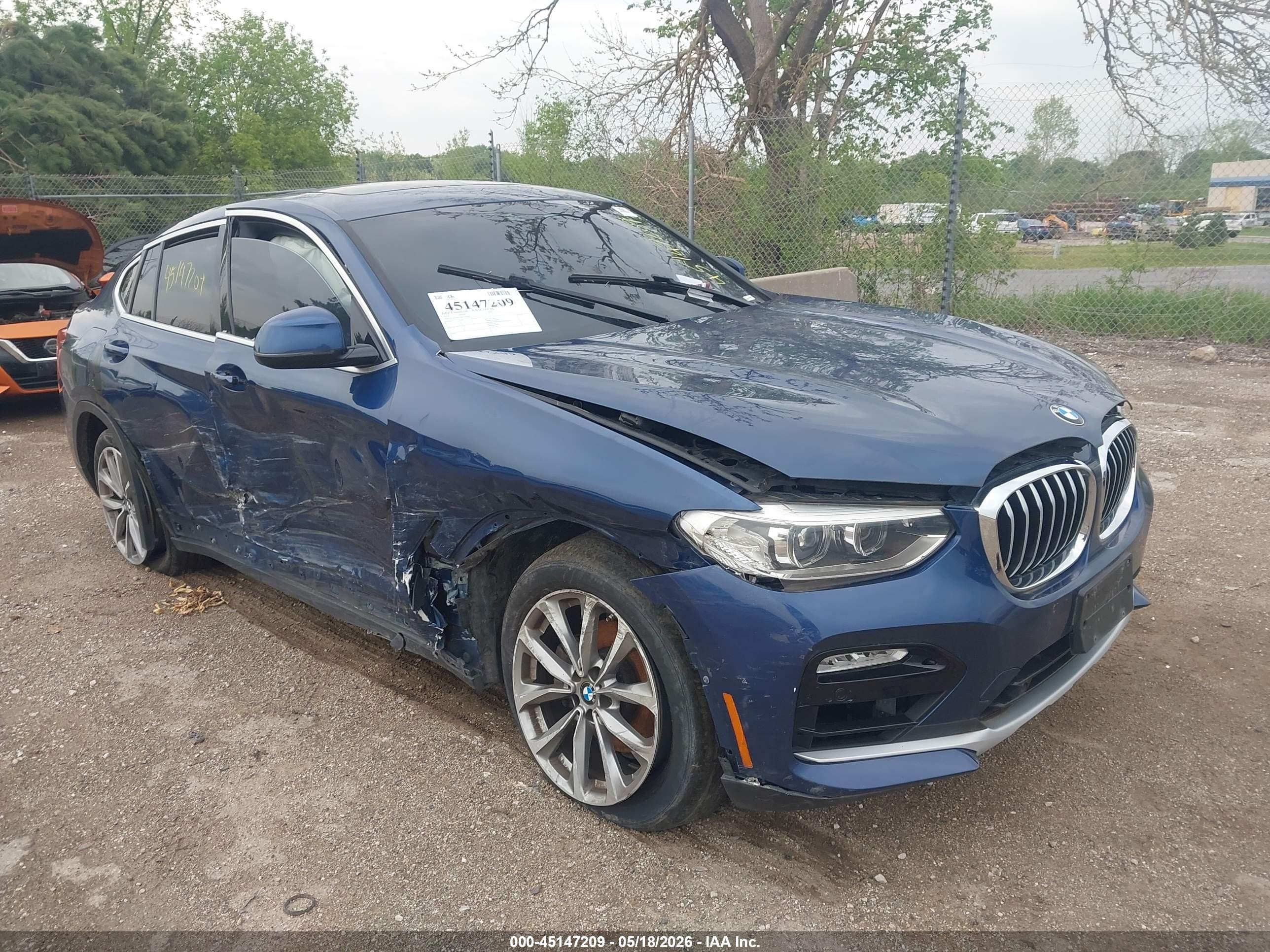 2019 BMW X4 xDrive30i, VIN 5UXUJ3C5XKLG56863 — Side