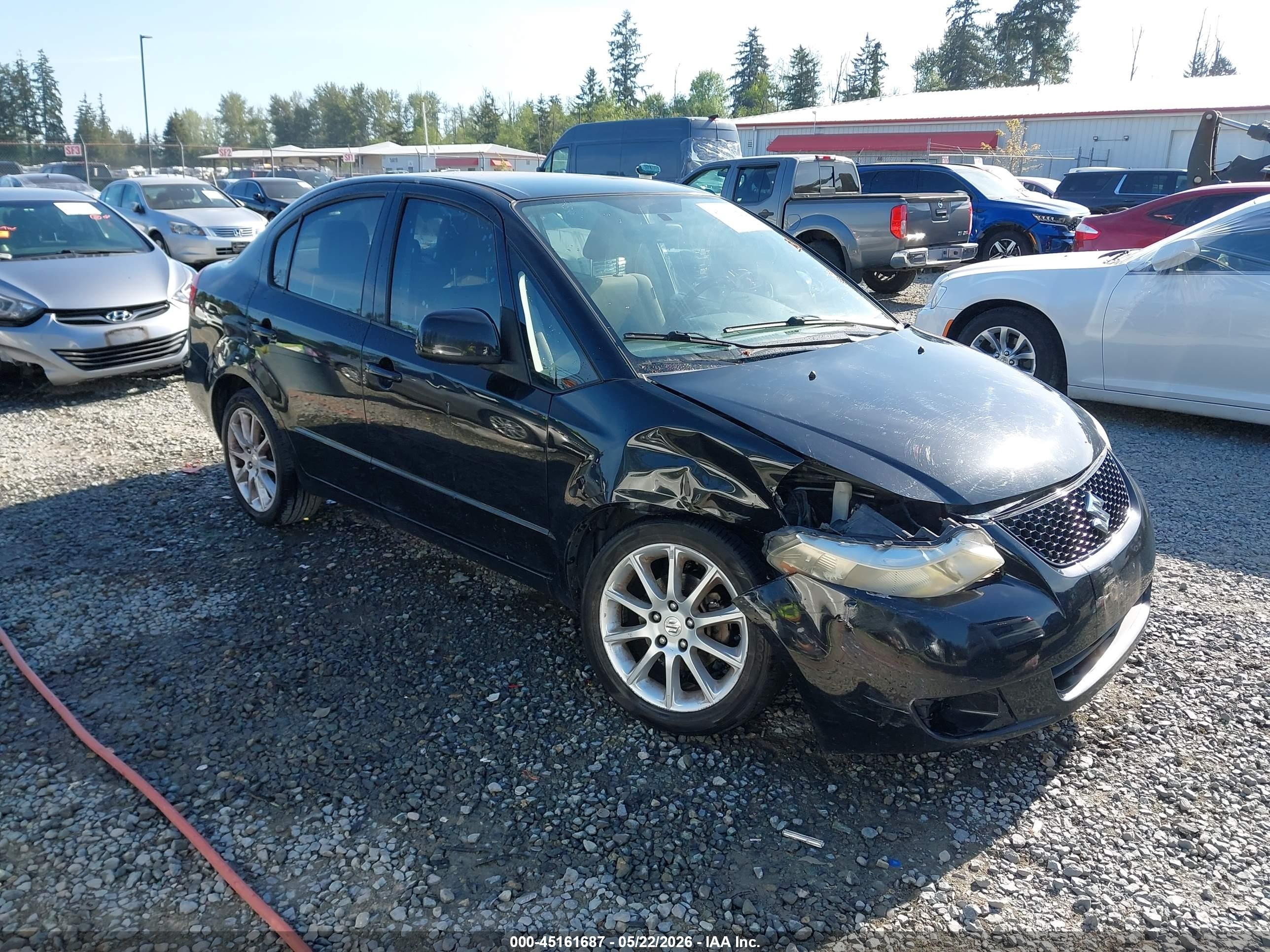 2011 Suzuki SX4 LE, VIN JS2YC5A21B6304810 — Перед