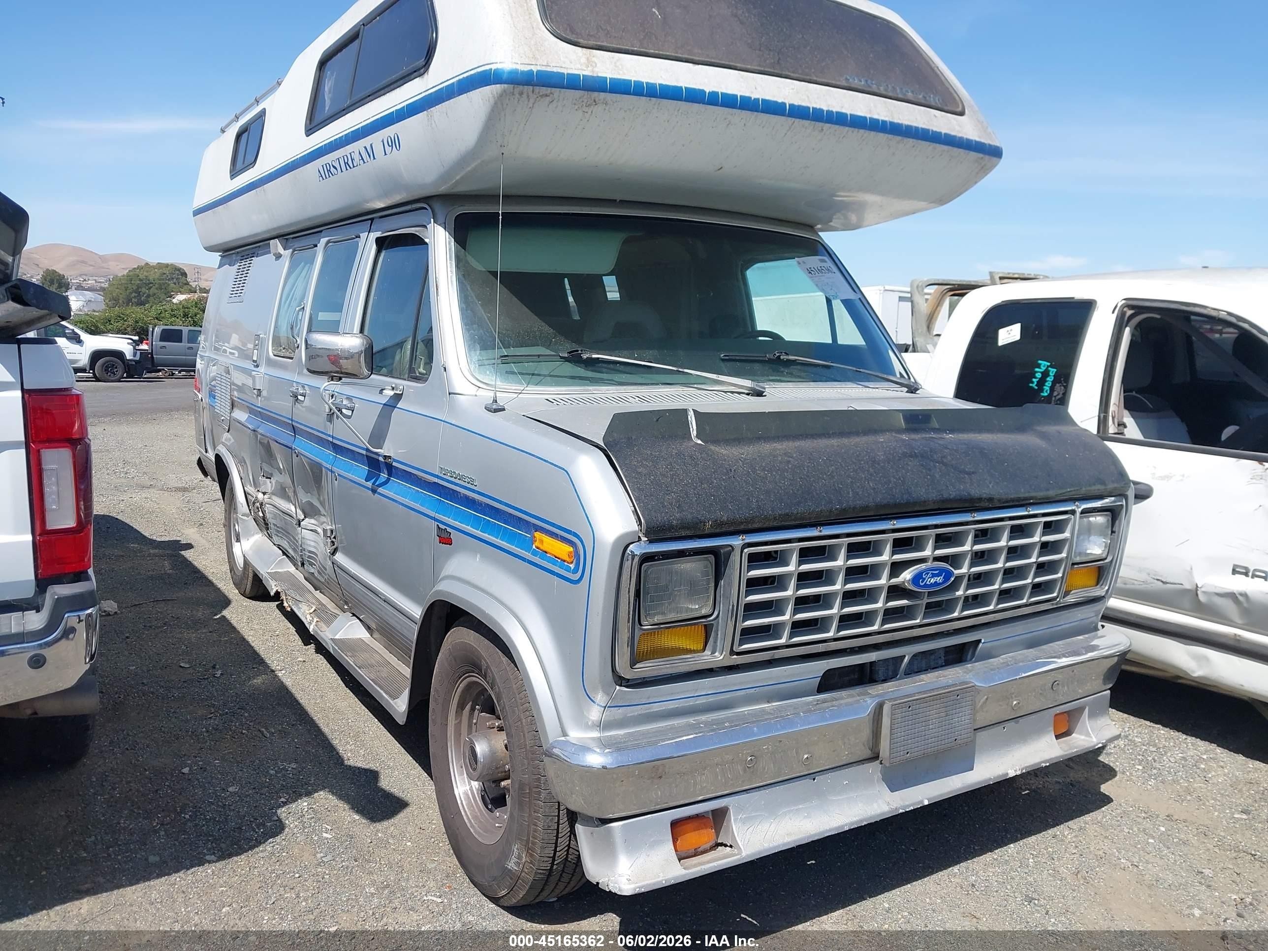 1991 Ford Econoline Cargo, VIN 1FDHS34M7MHA66883 — Side