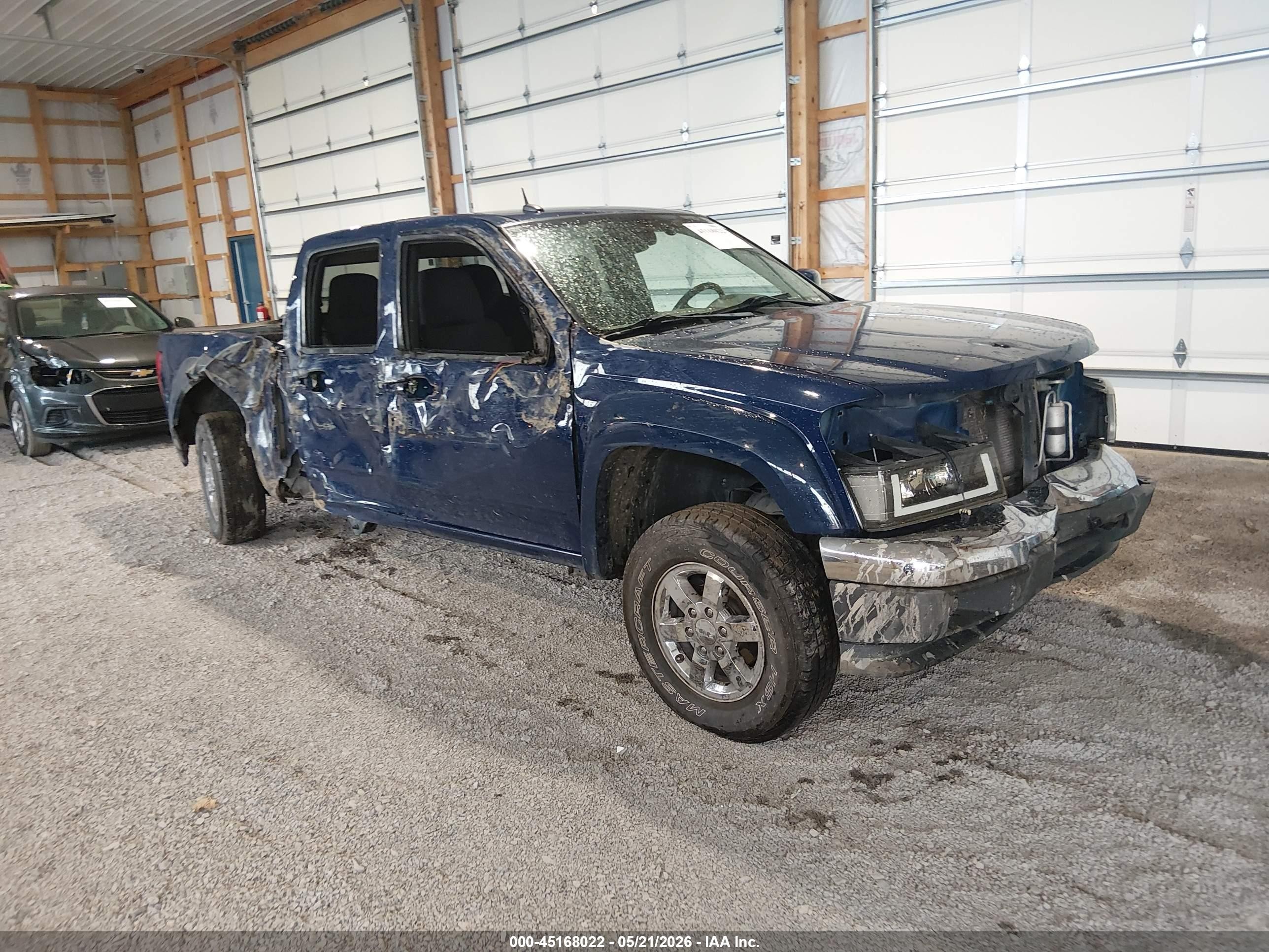 2011 GMC Canyon SLE1, VIN 1GTH6MFE8B8128762 — Rollover