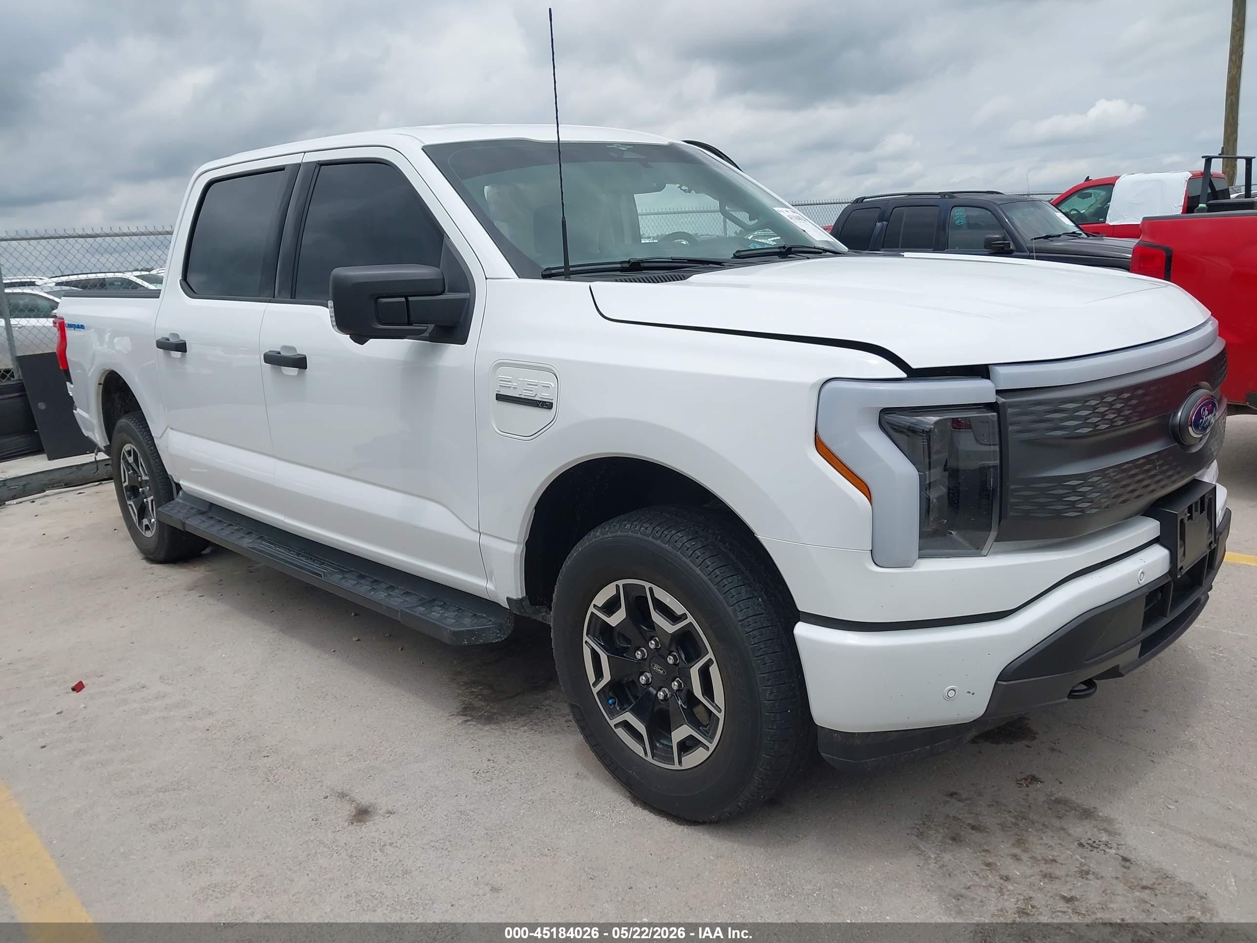 2023 Ford F-150 Lightning Pro, VIN 1FTVW1EL2PWG58715 — Side
