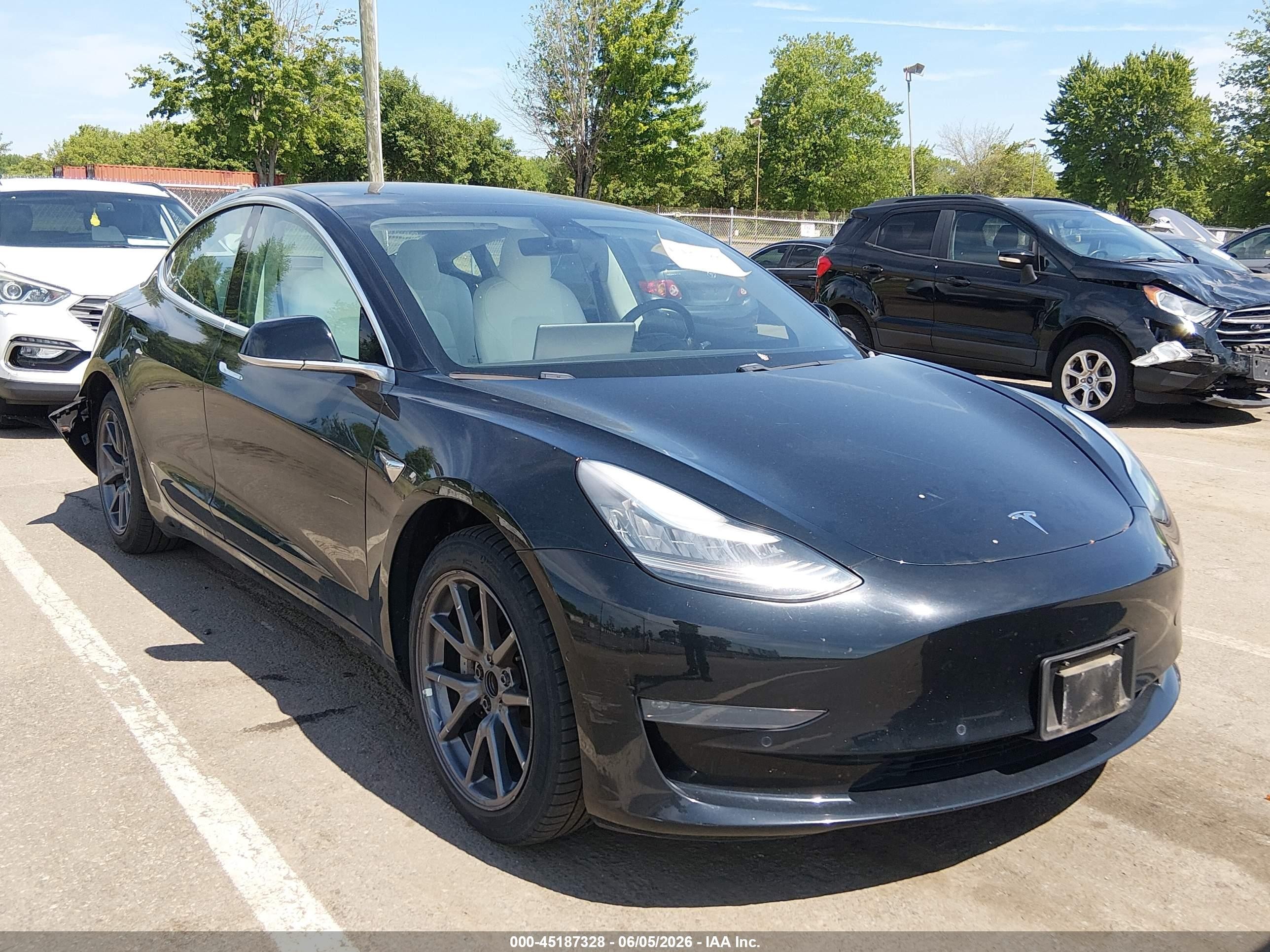 2019 Tesla Model 3 Mid Range, VIN 5YJ3E1EA4KF323543 — Rear end