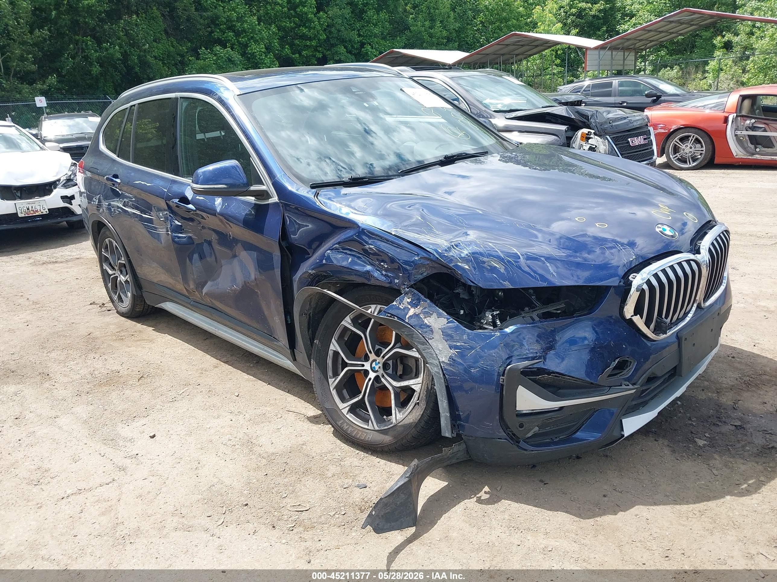 2020 BMW X1 xDrive28i, VIN WBXJG9C08L5P60820 — Side
