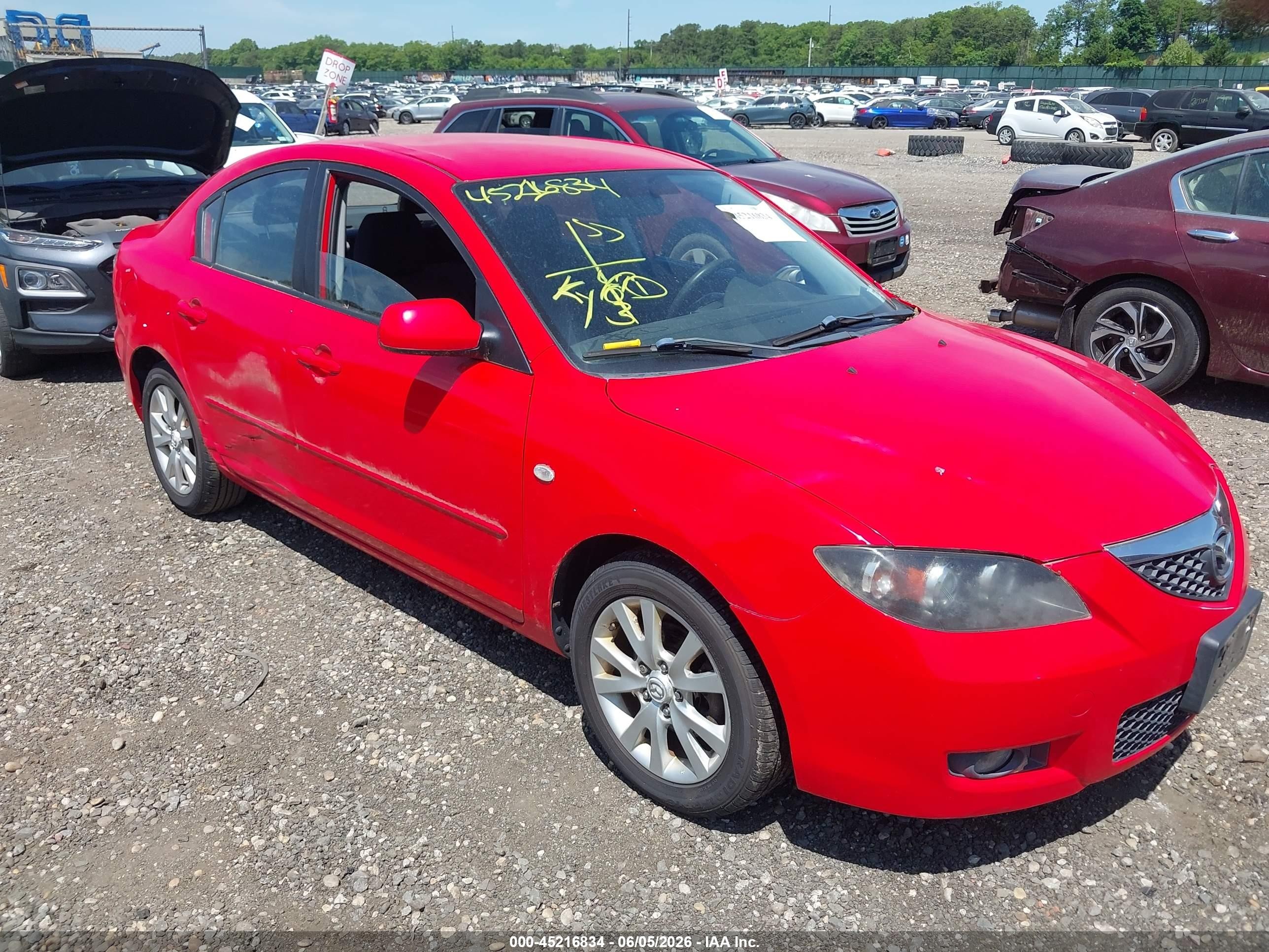 2007 Mazda 3 i Touring, VIN JM1BK32G671698228 — Side