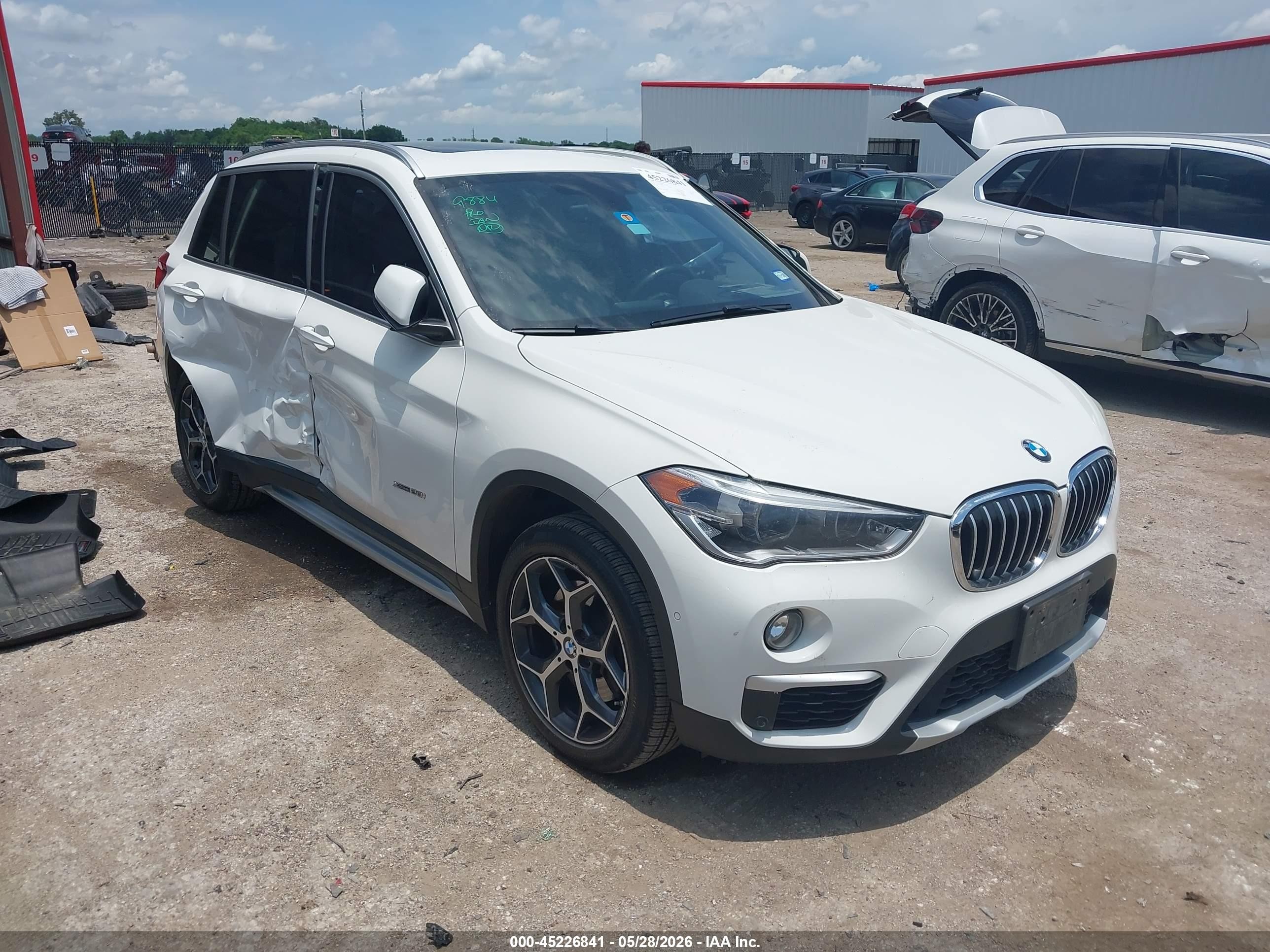 2016 BMW X1 xDrive28i, VIN WBXHT3C30GP883524 — Side