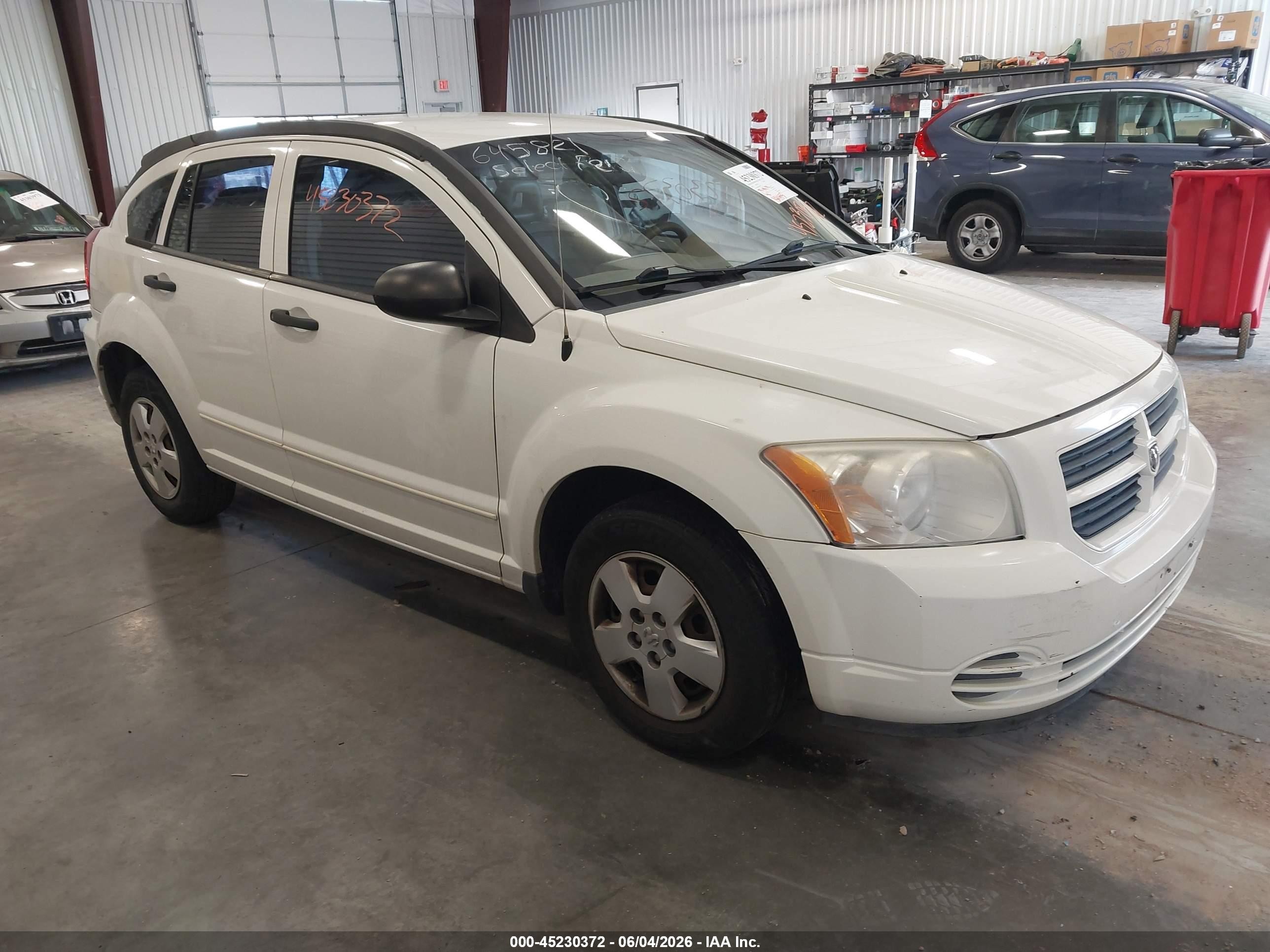 2008 Dodge Caliber SE, VIN 1B3HB28B28D645821 — Side