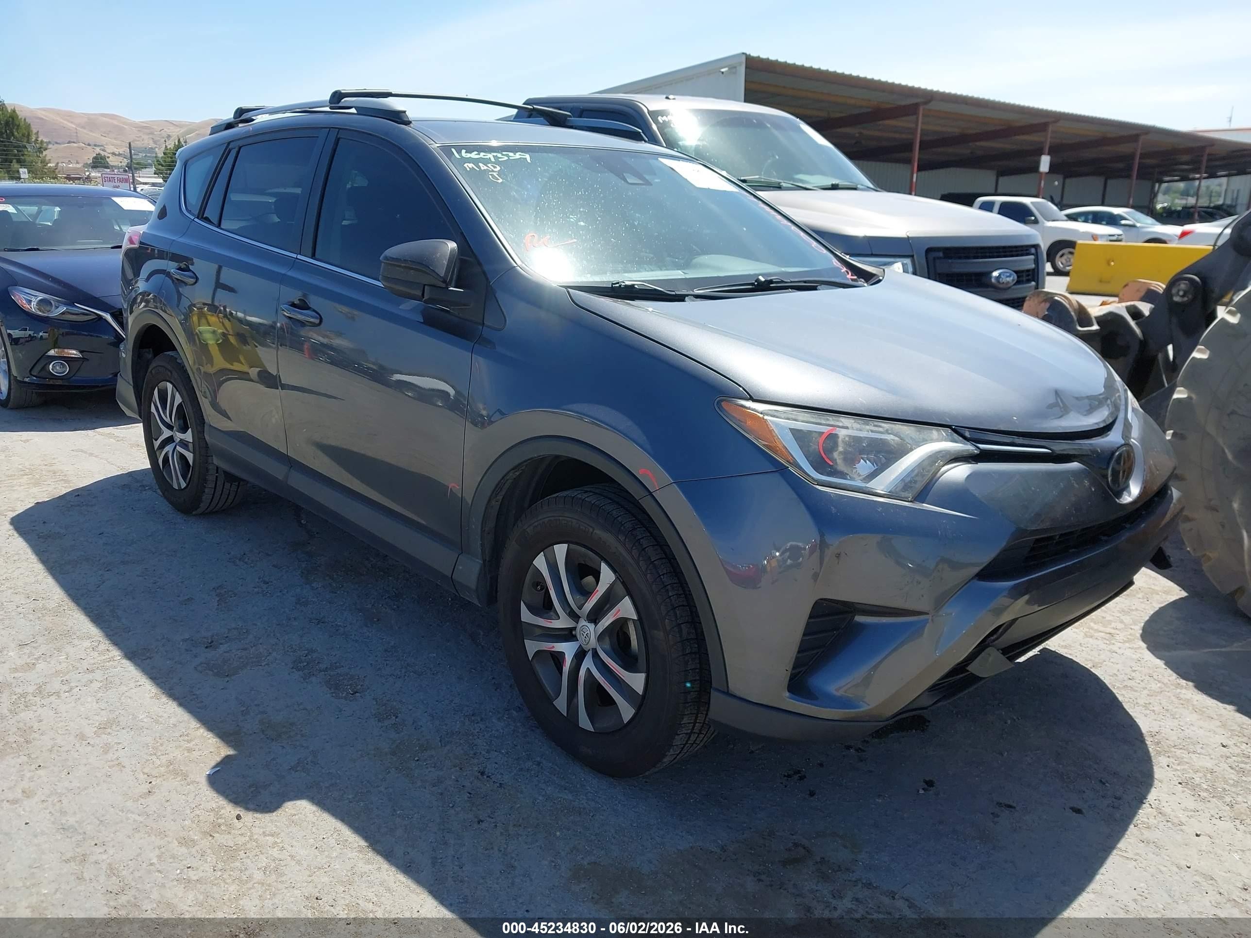 2018 Toyota RAV4 LE, VIN JTMZFREV4JD121896 — All over